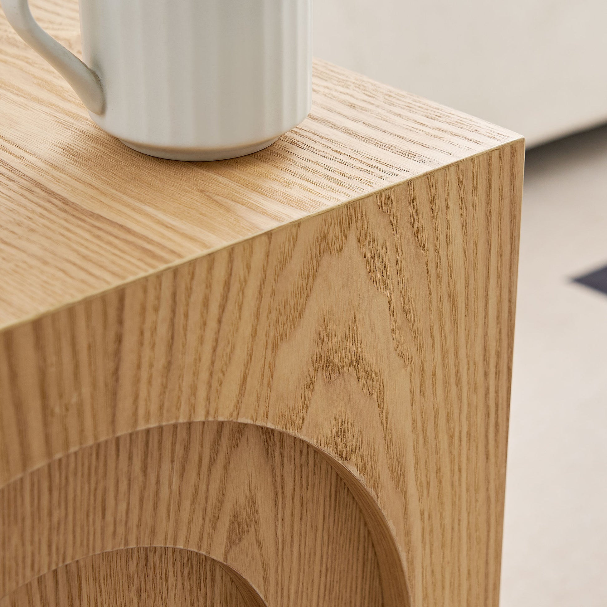 Natural oak wood side table with subtle carved arcs ideal for modern homes