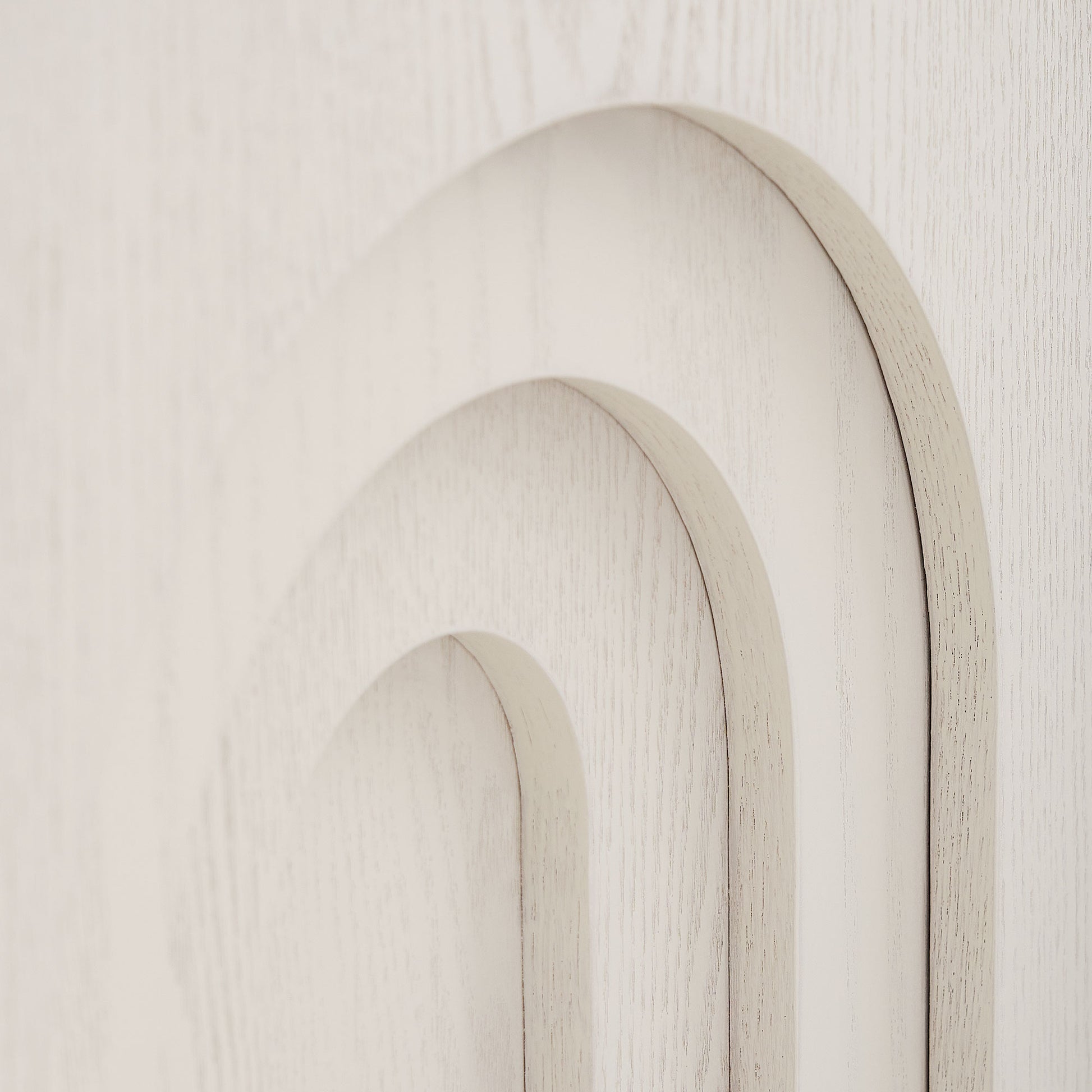 Closeup of layered archway in light wood finish modern design accent