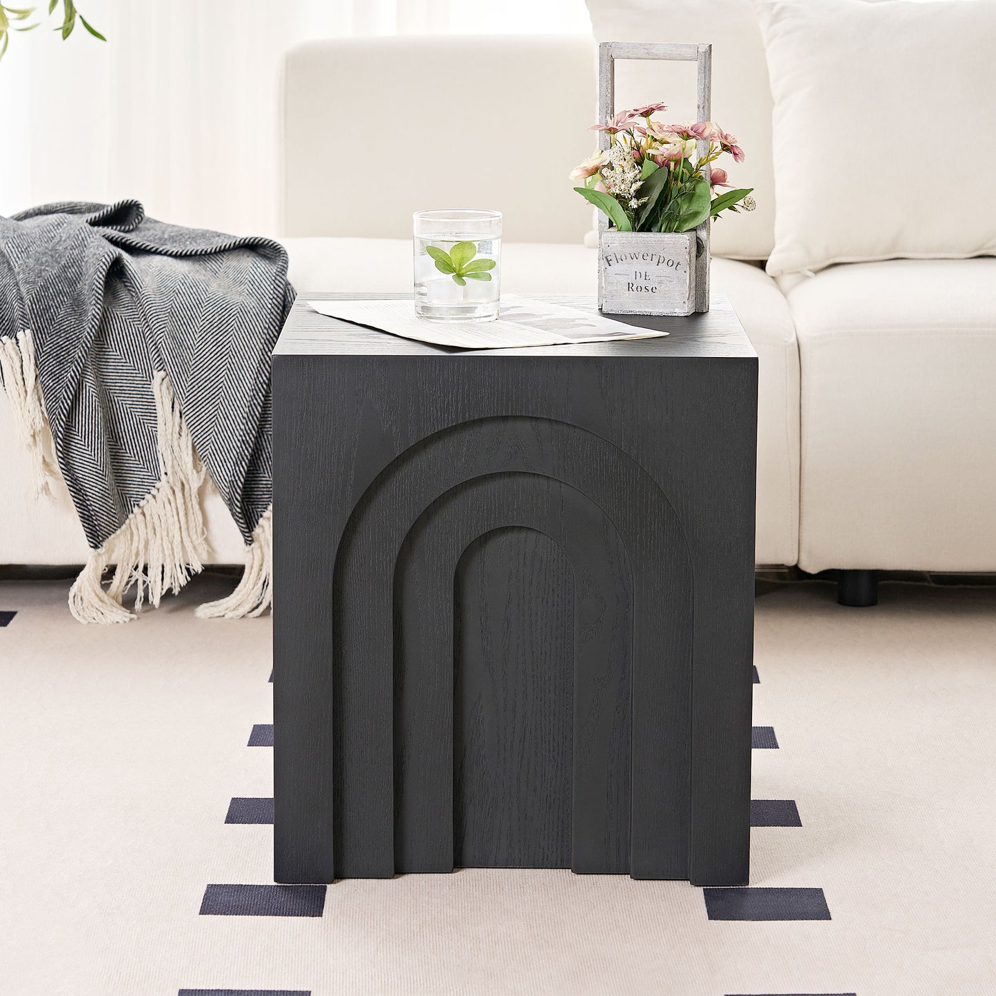 Black wooden side table with arched panel design