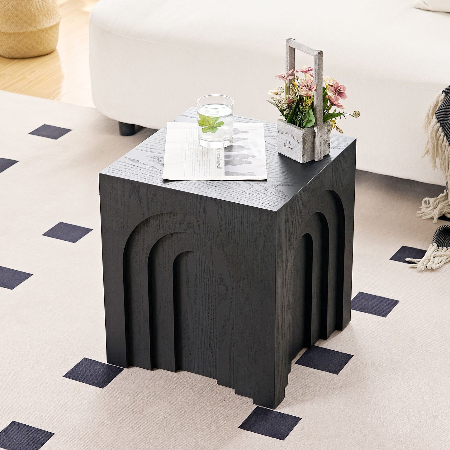 Black wood end table with carved arch design and minimalist style ideal for modern living rooms