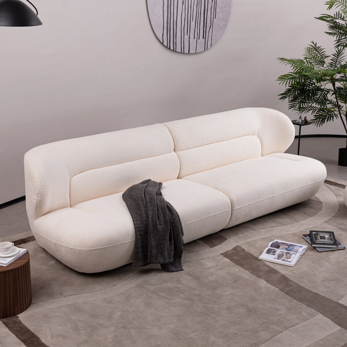 Cream boucle modular sofa with plush texture and rounded silhouette perfect for modern living rooms