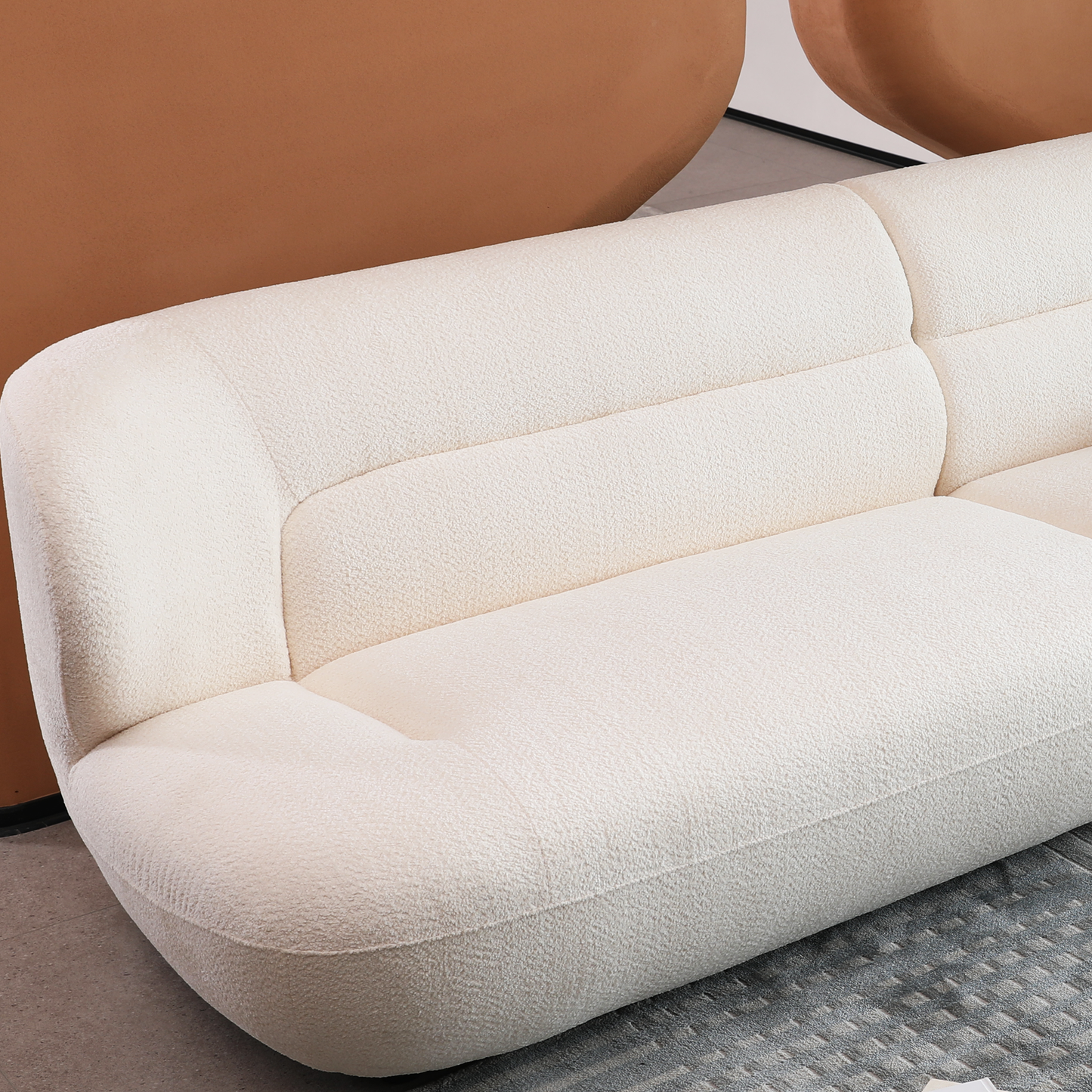 Cream boucle fabric modular sofa with curved armrest for modern living rooms