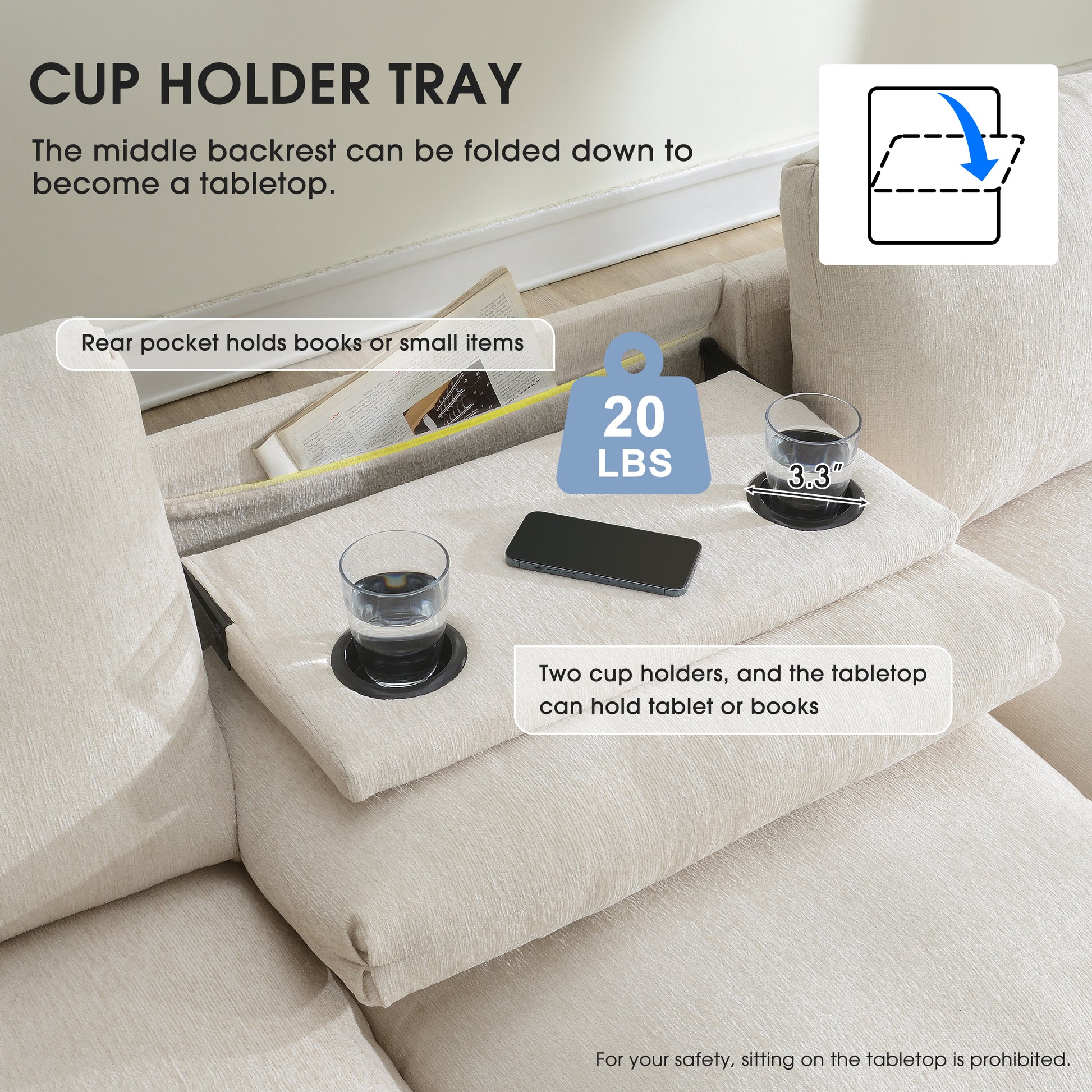 Beige sofa with integrated cup holder tray and tabletop holding glasses and phone