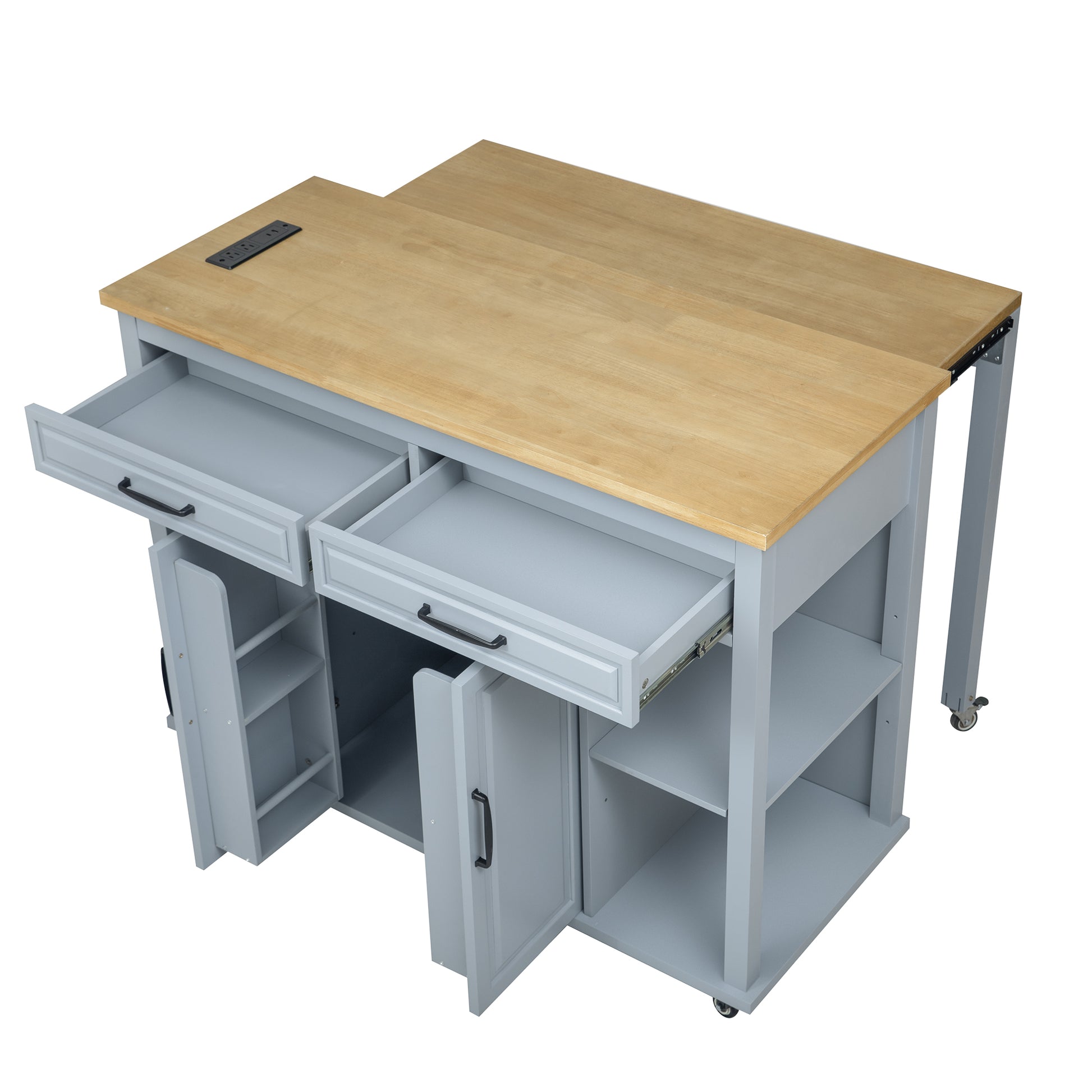 Gray kitchen island with natural wood top featuring power outlets and open drawers