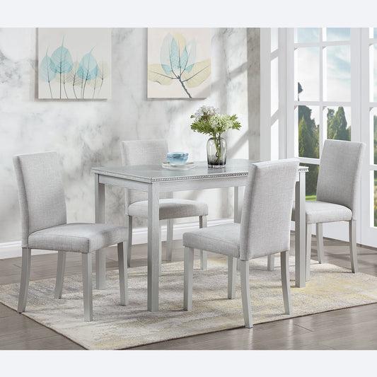 Light gray upholstered dining chairs set of  around a silver wood dining table