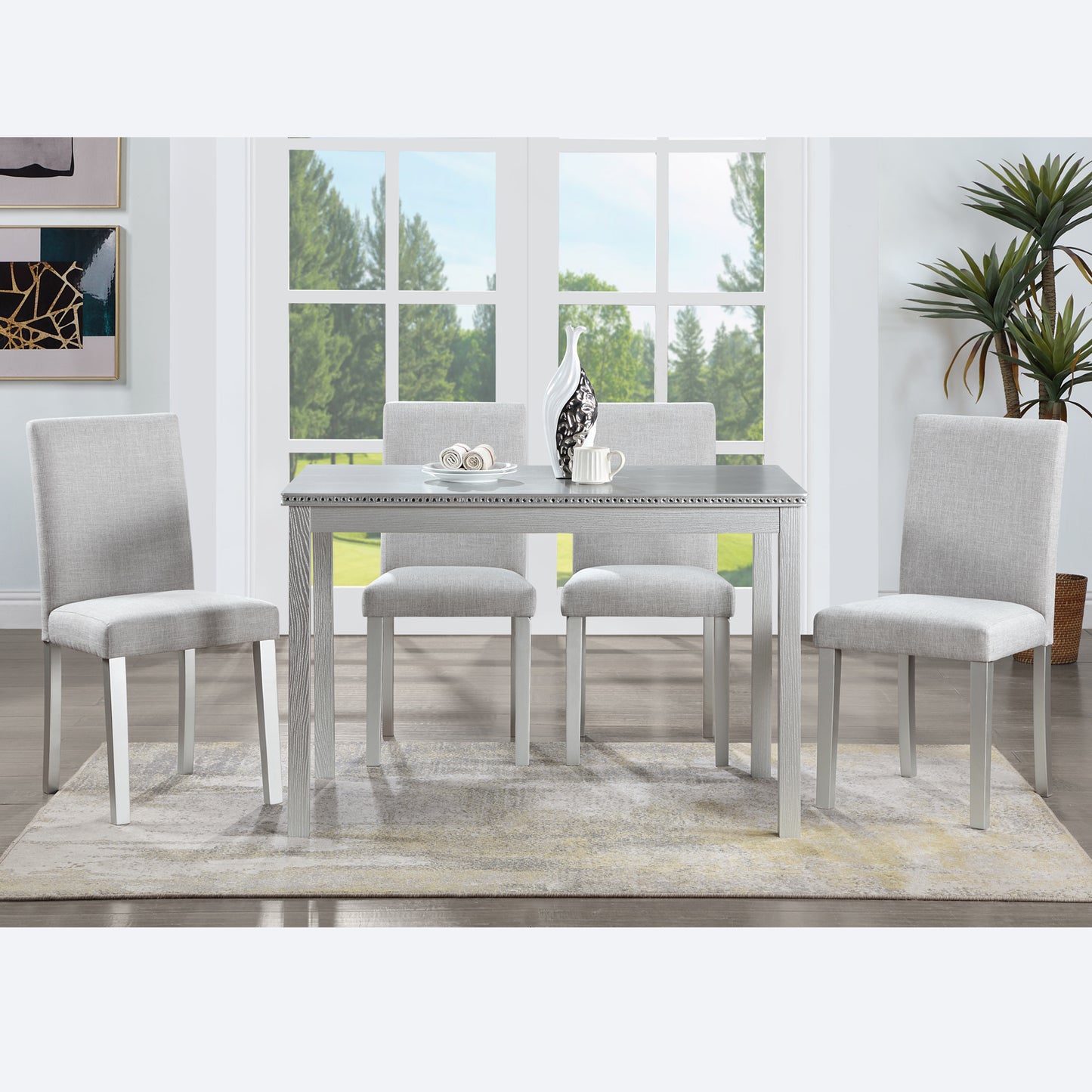 Gray upholstered dining chair with silver legs