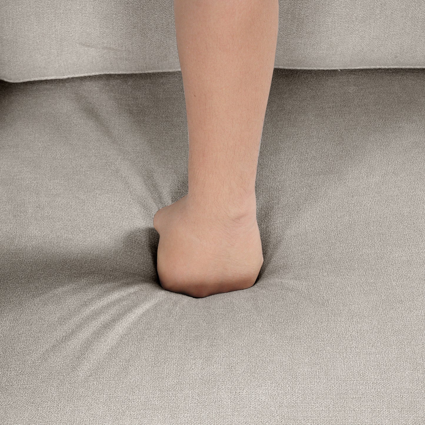 Soft grey fabric couch cushion with plush seating