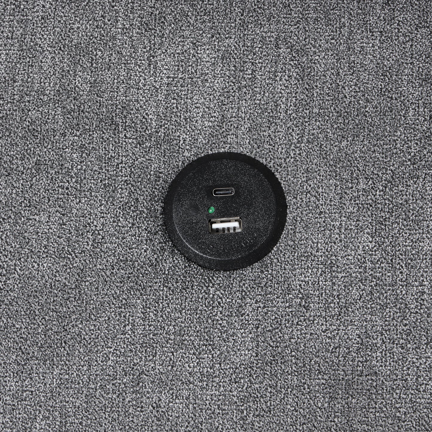 Black circular power hub with USB and USBC ports ideal for desks