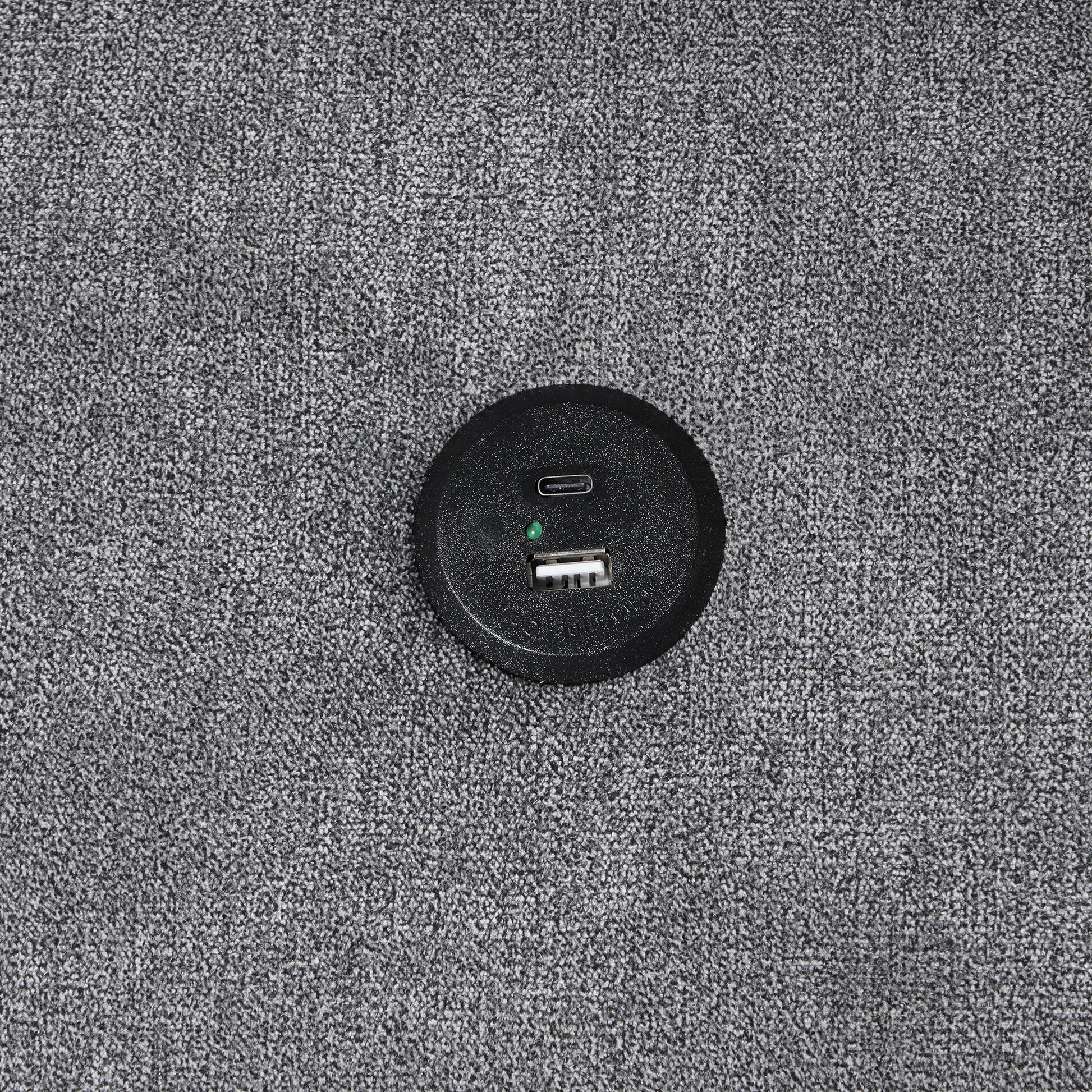 Black circular power hub with USB and USBC ports ideal for desks