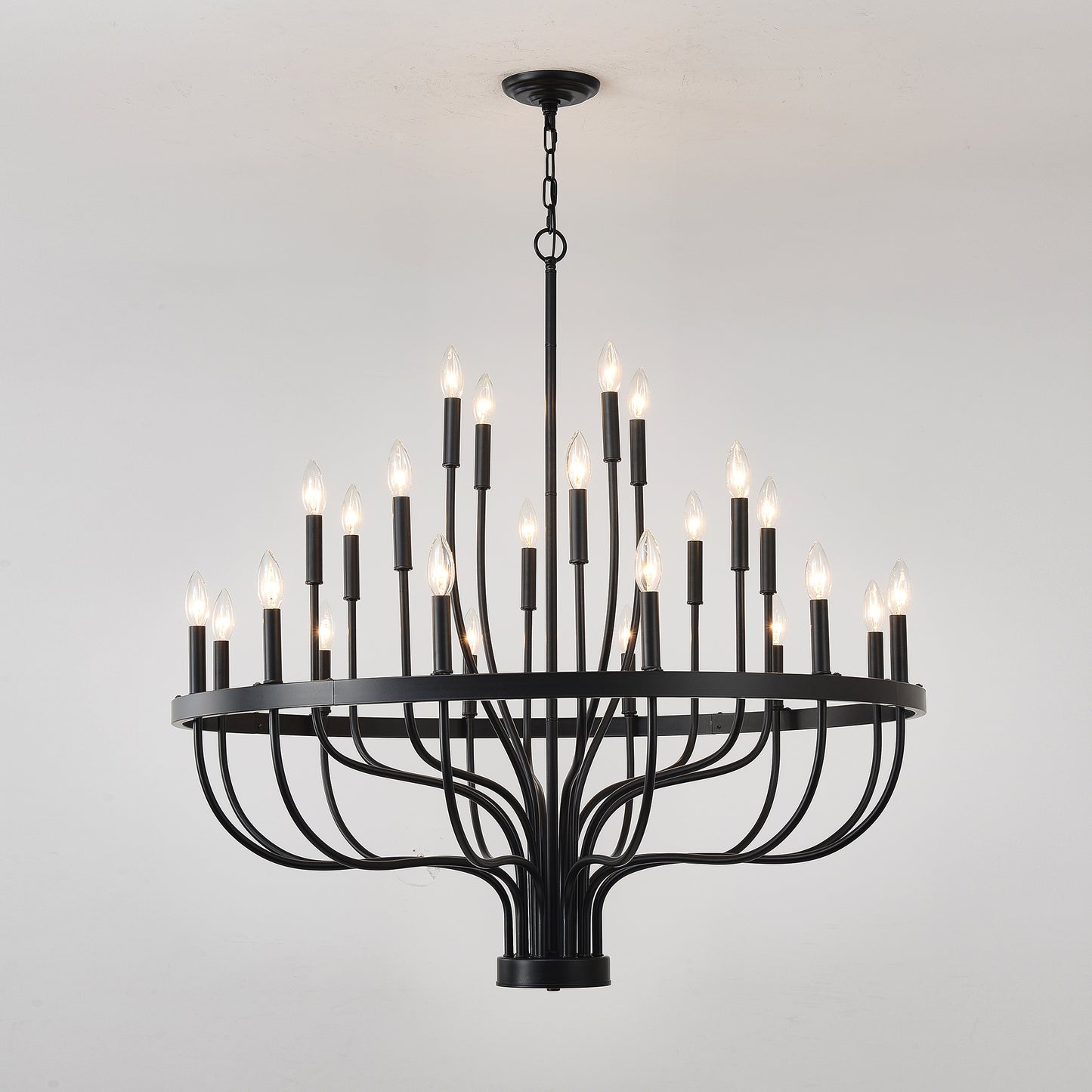 Black wrought iron light tiered chandelier with candlestyle bulbs ideal for dining rooms