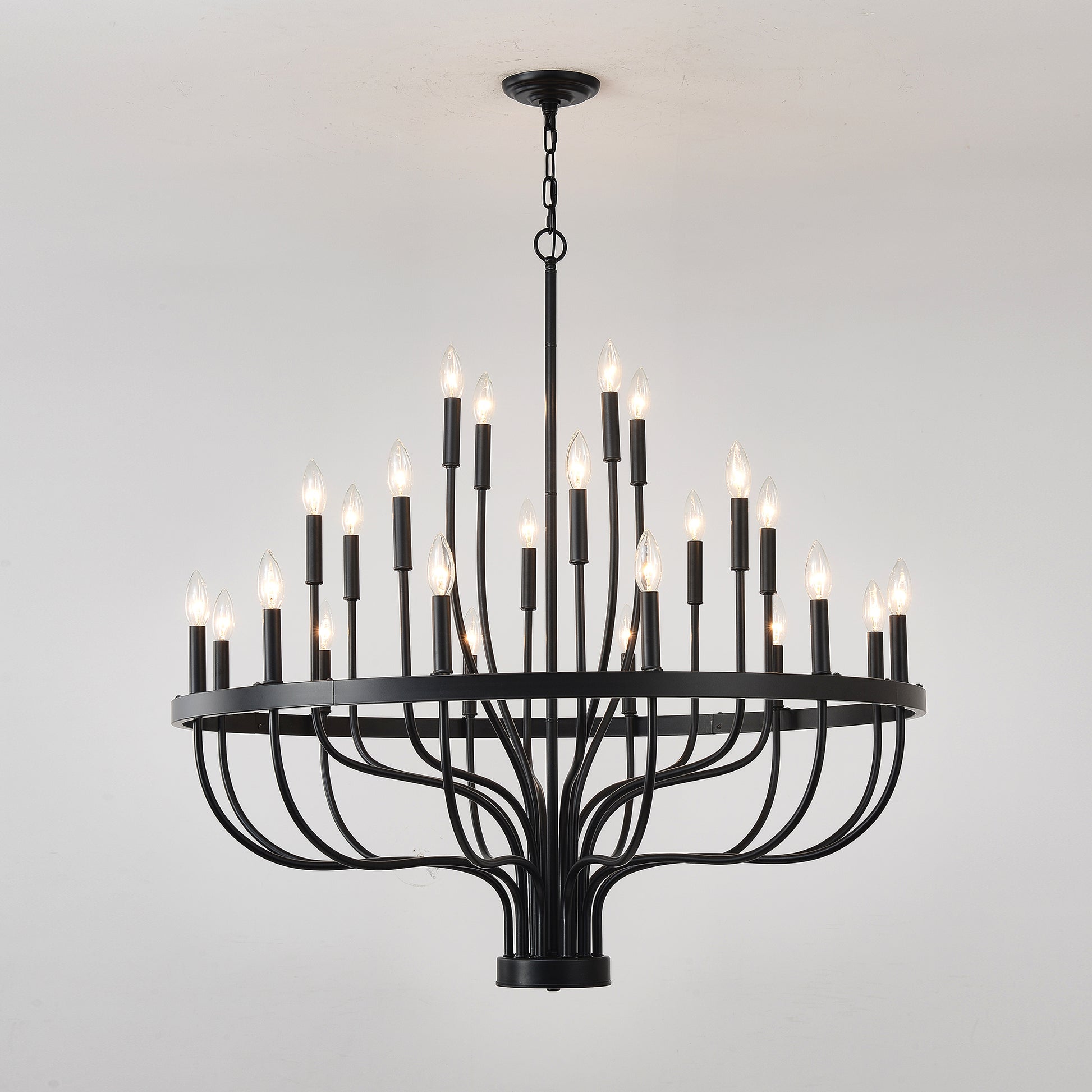 Black wrought iron light tiered chandelier with candlestyle bulbs ideal for dining rooms