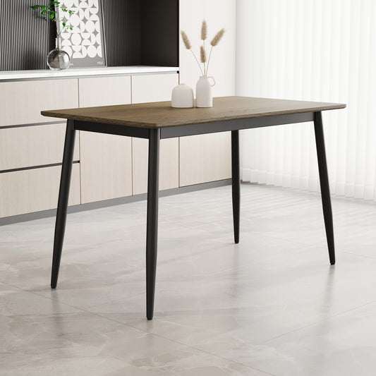 Modern dining table with a warm woodlook top and sleek black tapered legs