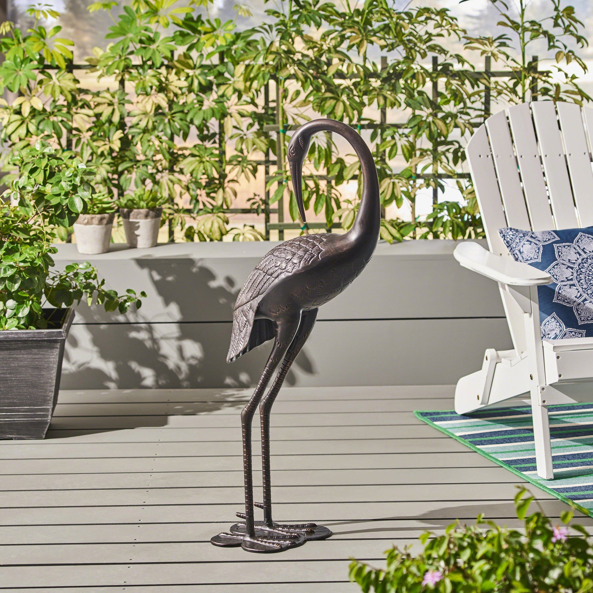 Bronze metal heron statue with intricate feather details ideal for garden decor