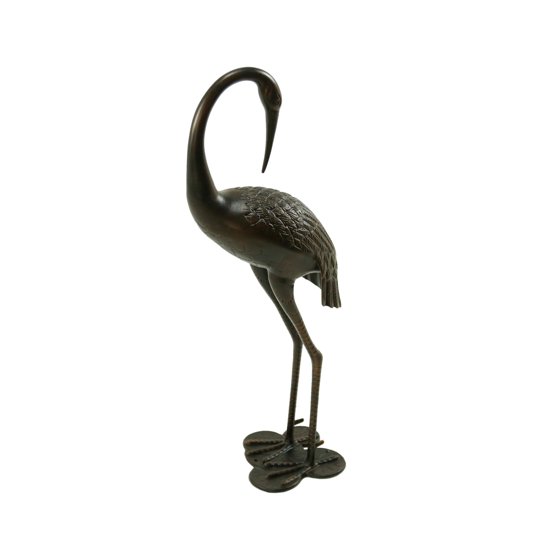 Bronze crane figurine with detailed feather texture and clawed feet