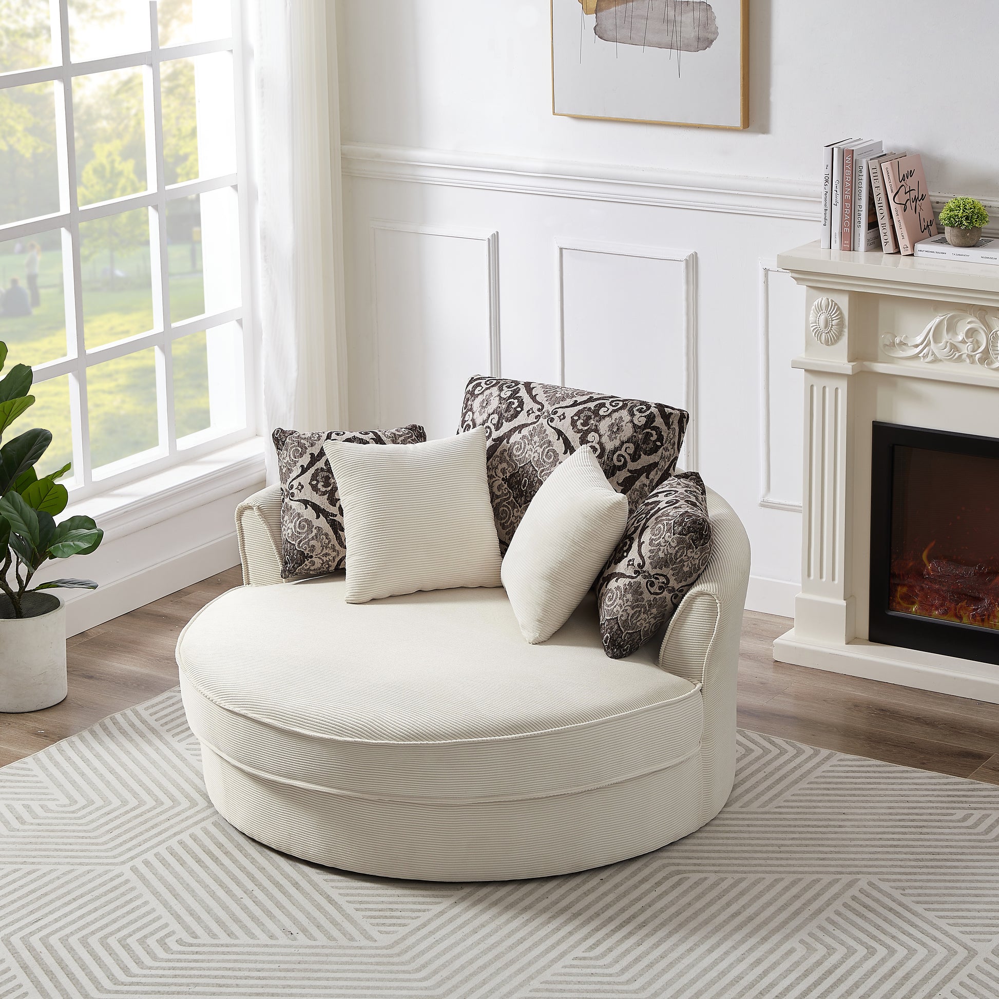 Cream corduroy round accent chair with patterned and textured throw pillows