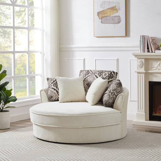 Round accent chair in cream corduroy with ornate floral patterned throw pillows