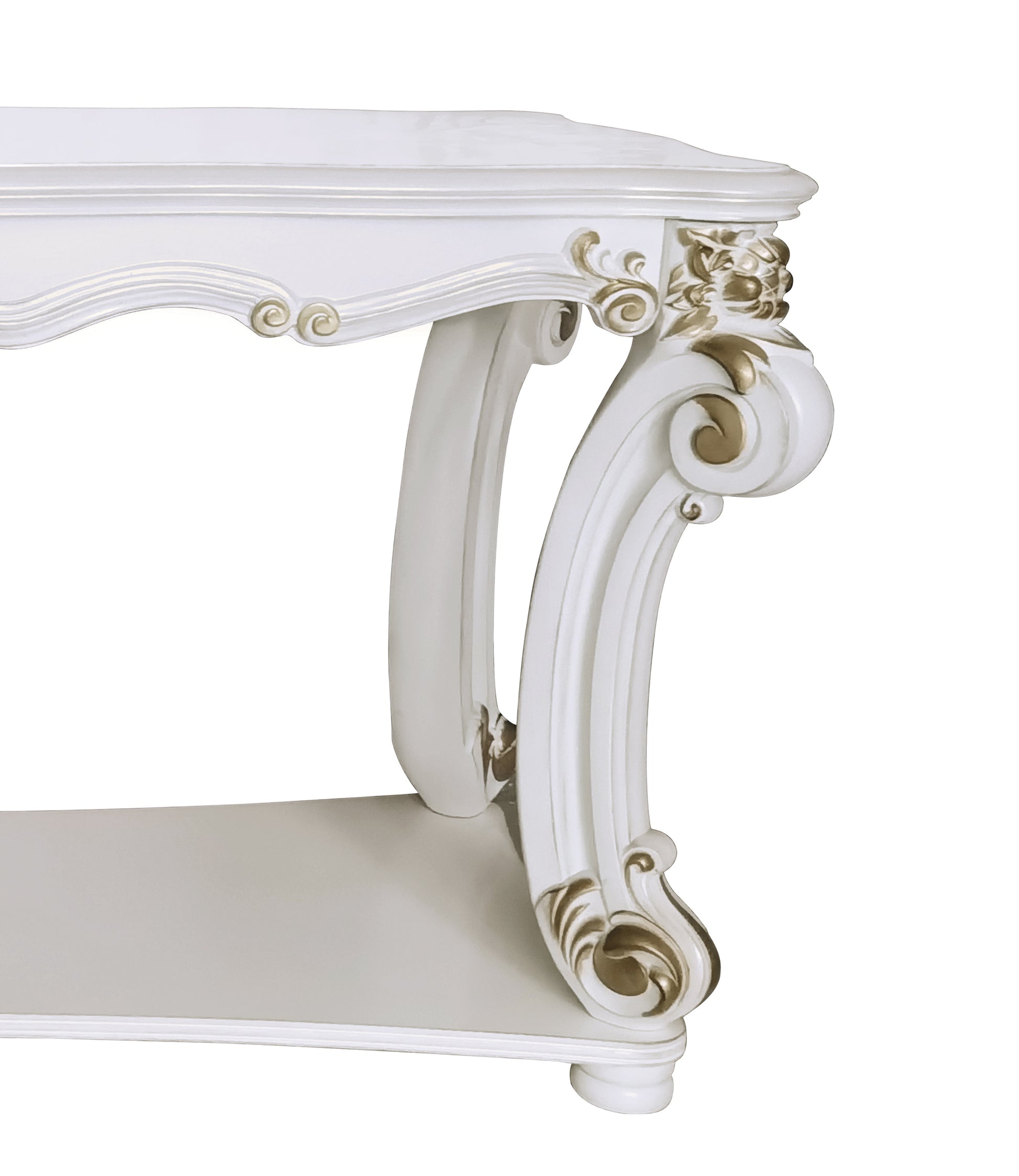 White ornate carved side table with gold accents and curved legs