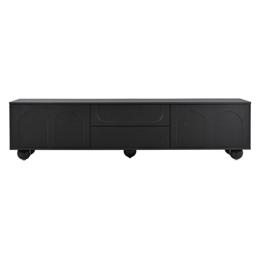 Black modern media console with arched door details and ball feet