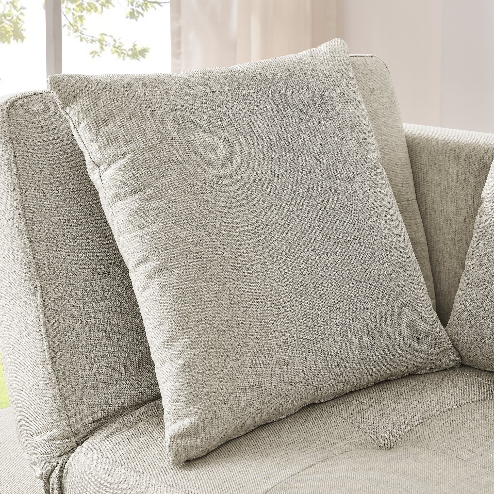 Textured light grey woven throw pillow with a clean modern design