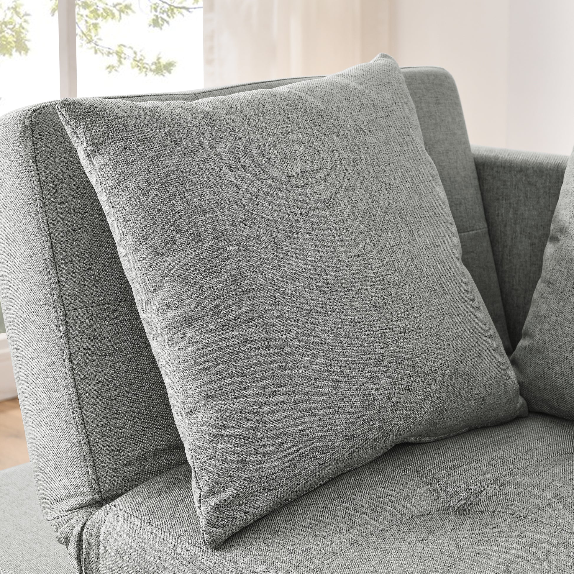 Textured gray throw pillow with plush filling perfect for living room comfort