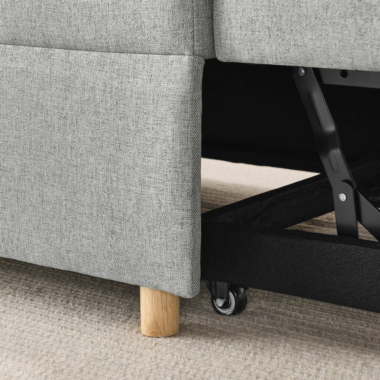 Gray fabric sofa base with wooden leg and rolling caster wheel for easy mobility