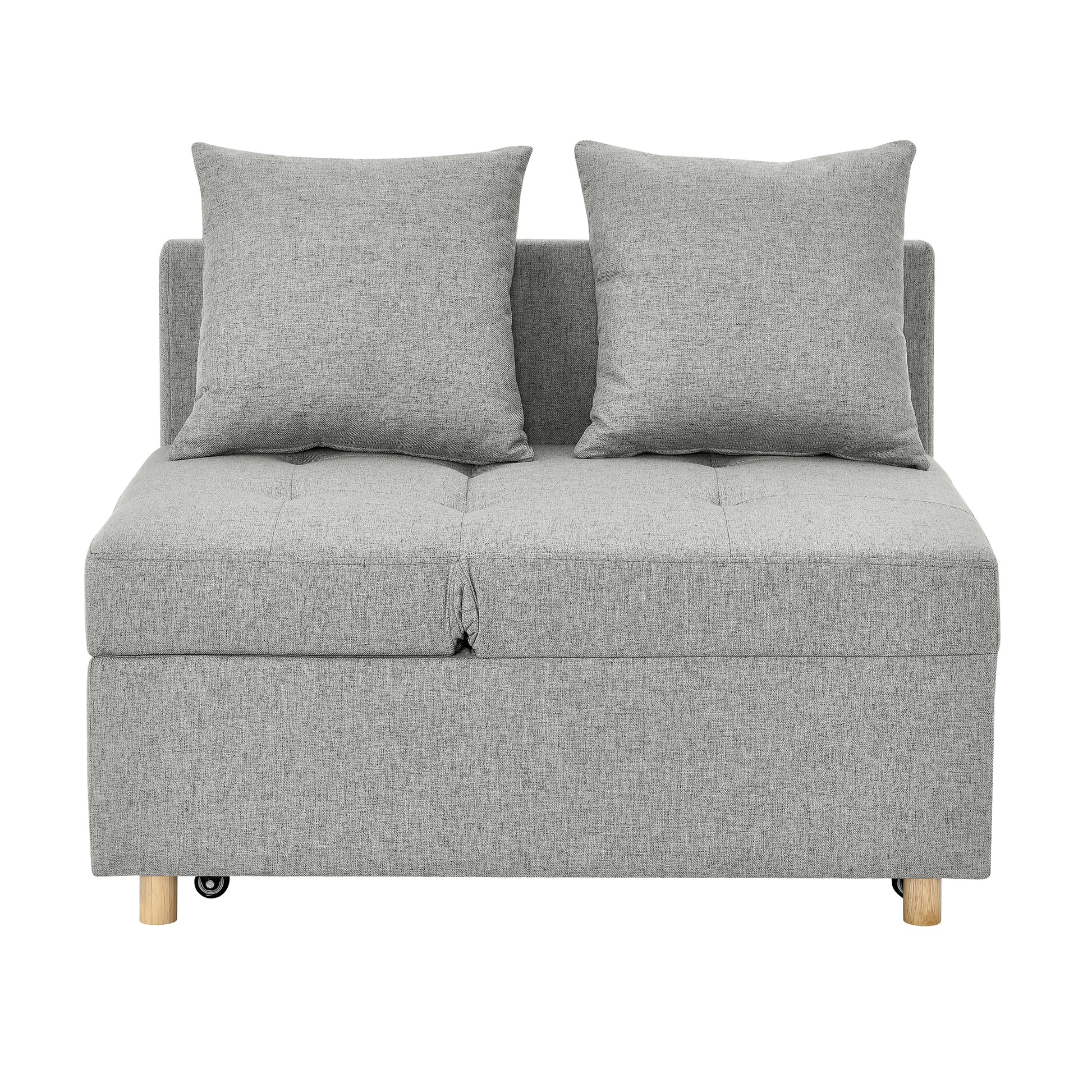 Compact grey fabric sofa bed with two throw pillows ideal for small spaces