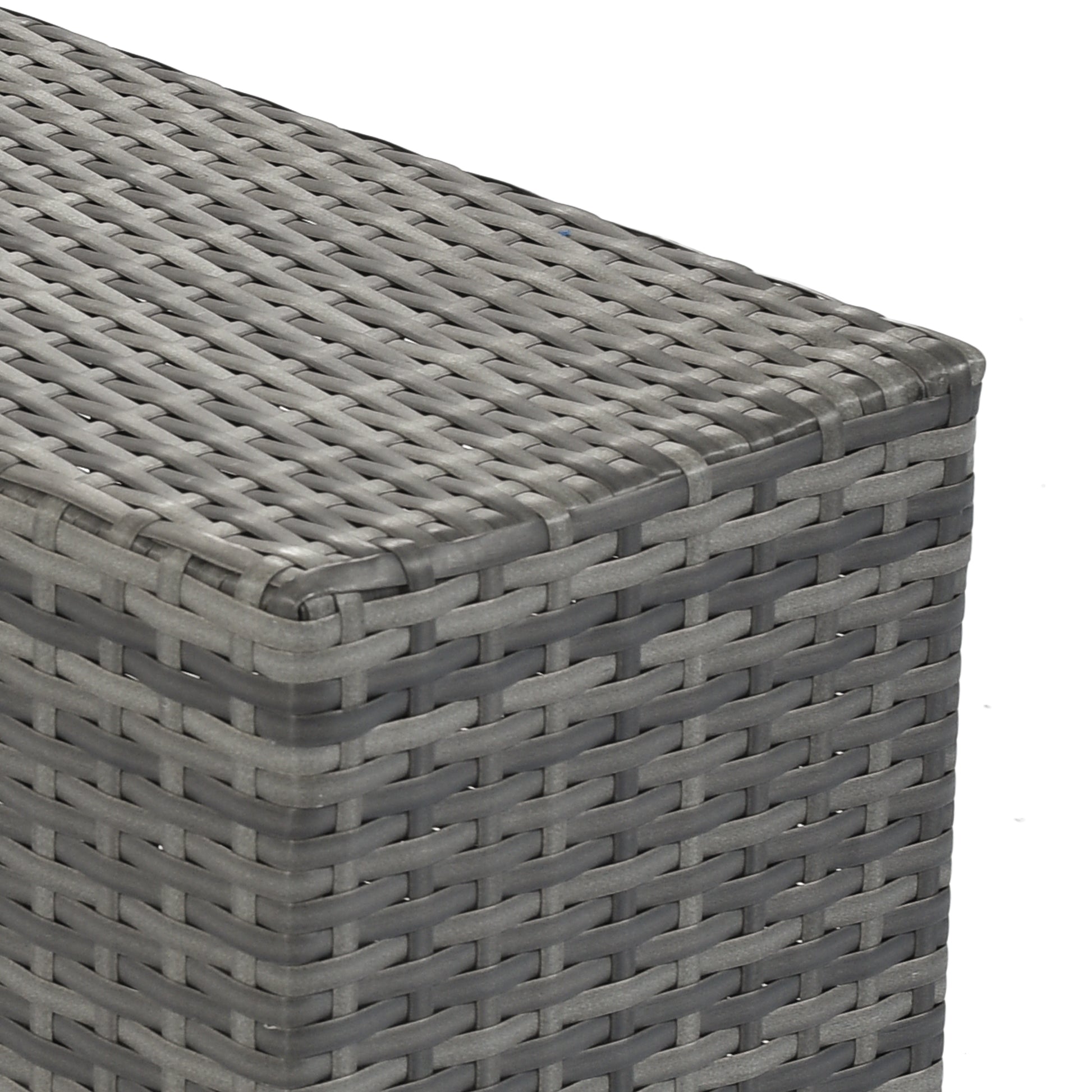 Grey rattan side table corner detail showing woven texture