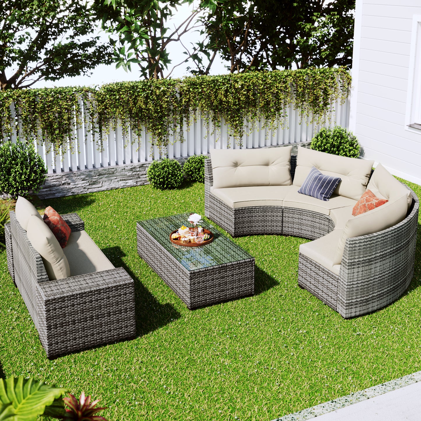 Grey rattan outdoor sectional sofa with beige cushions and glasstop coffee table