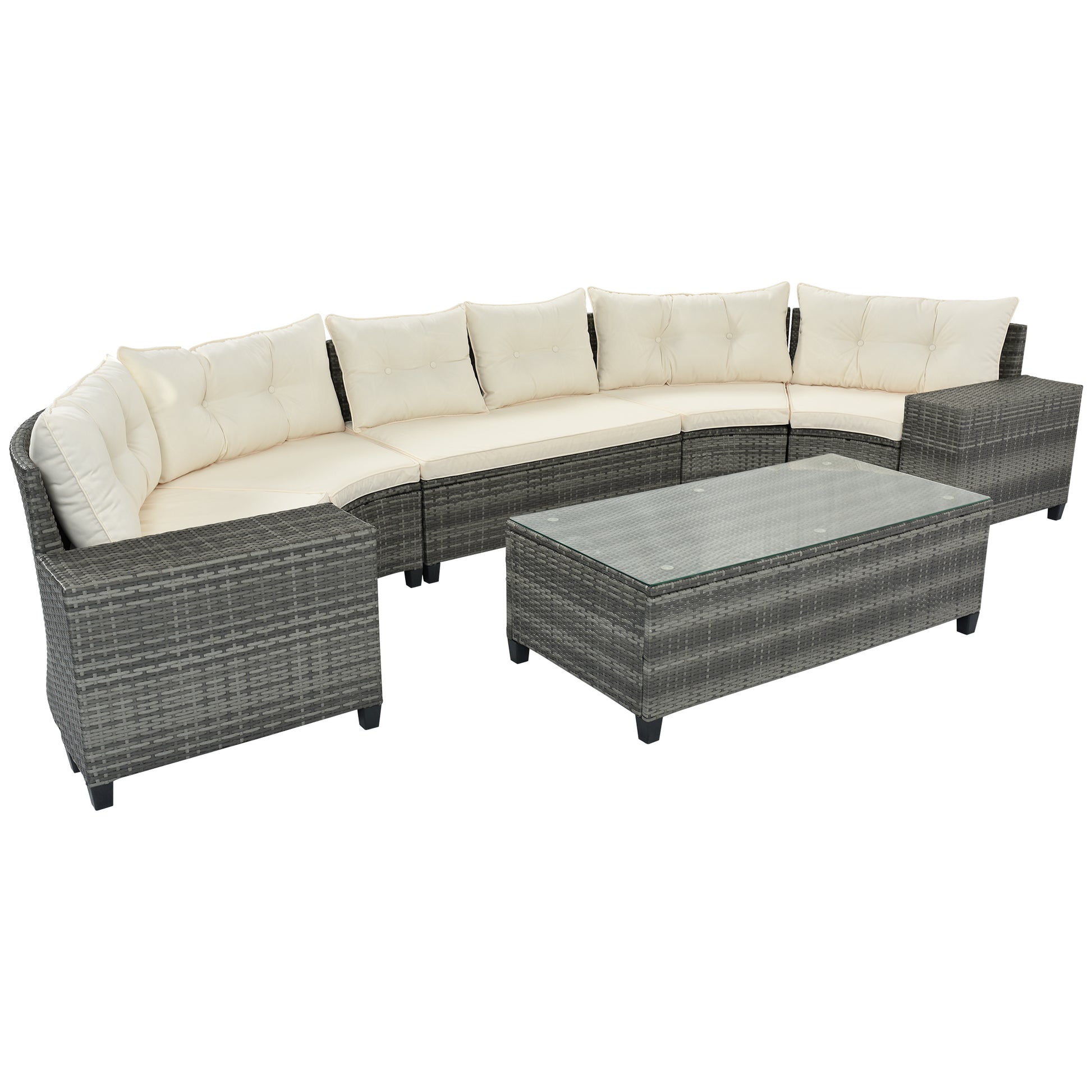 Curved grey rattan sectional sofa with cream cushions and glasstop coffee table