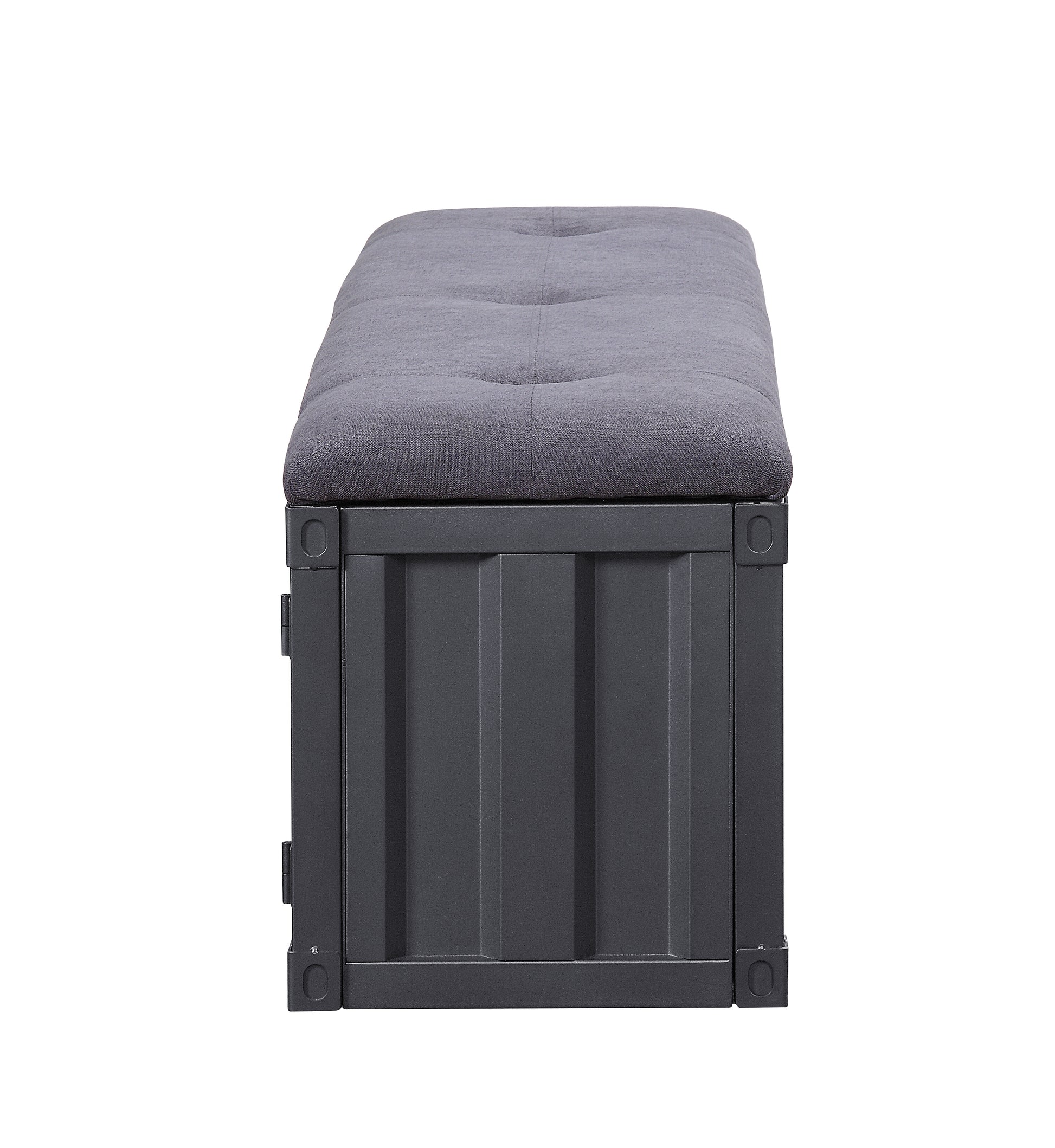 Dark gray upholstered storage bench with button tufting and corrugated metal base