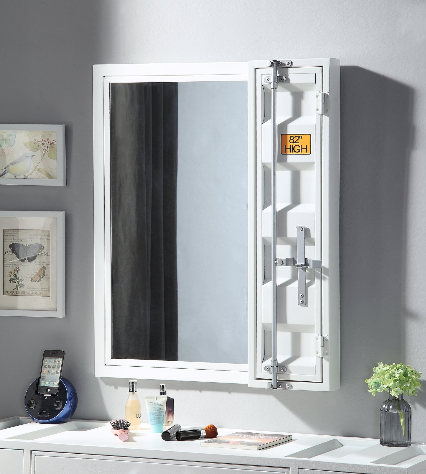 White industrialstyle medicine cabinet with a mirrored door and chrome hardware