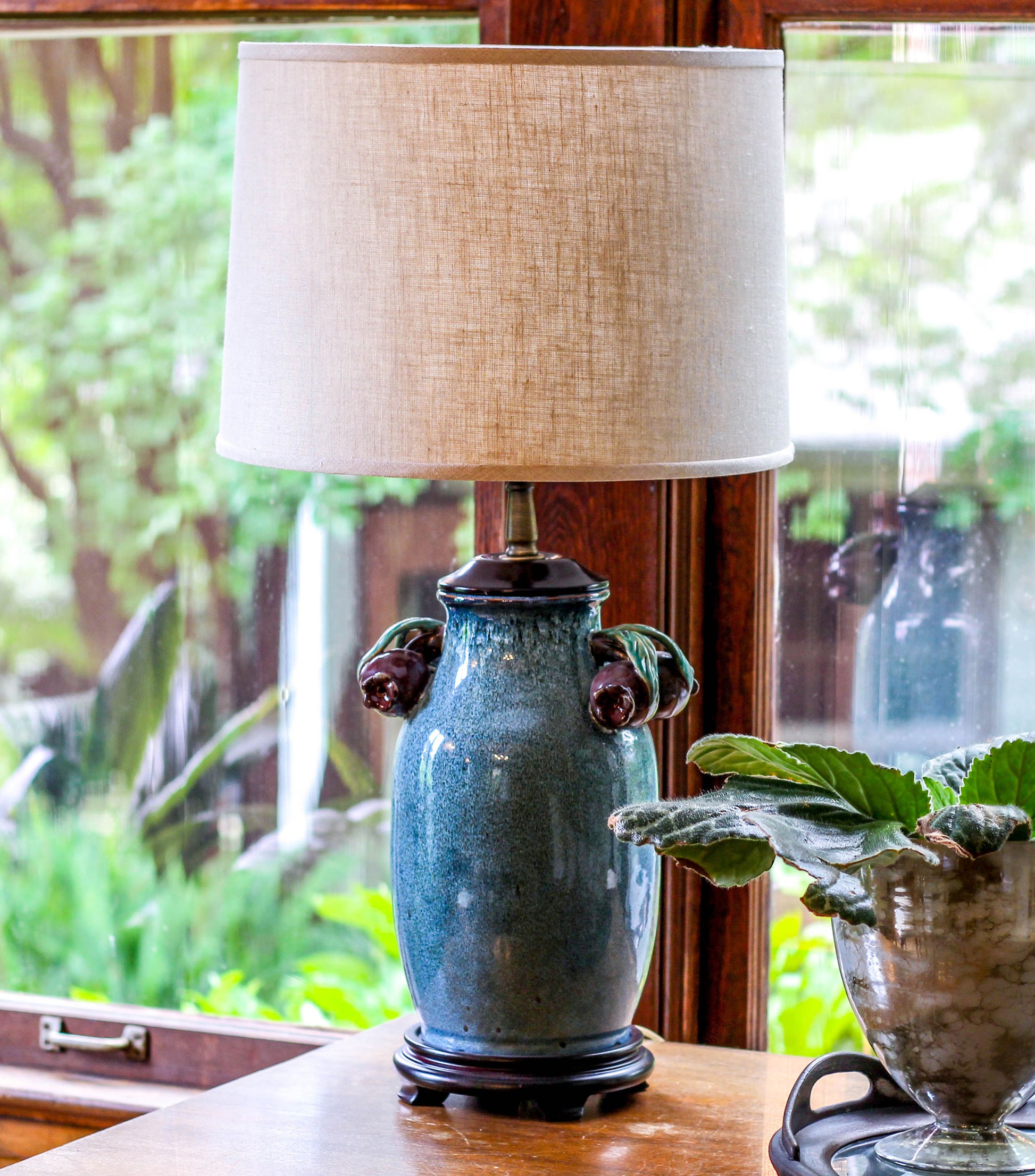 Decorative blue ceramic table lamp with textured linen shade