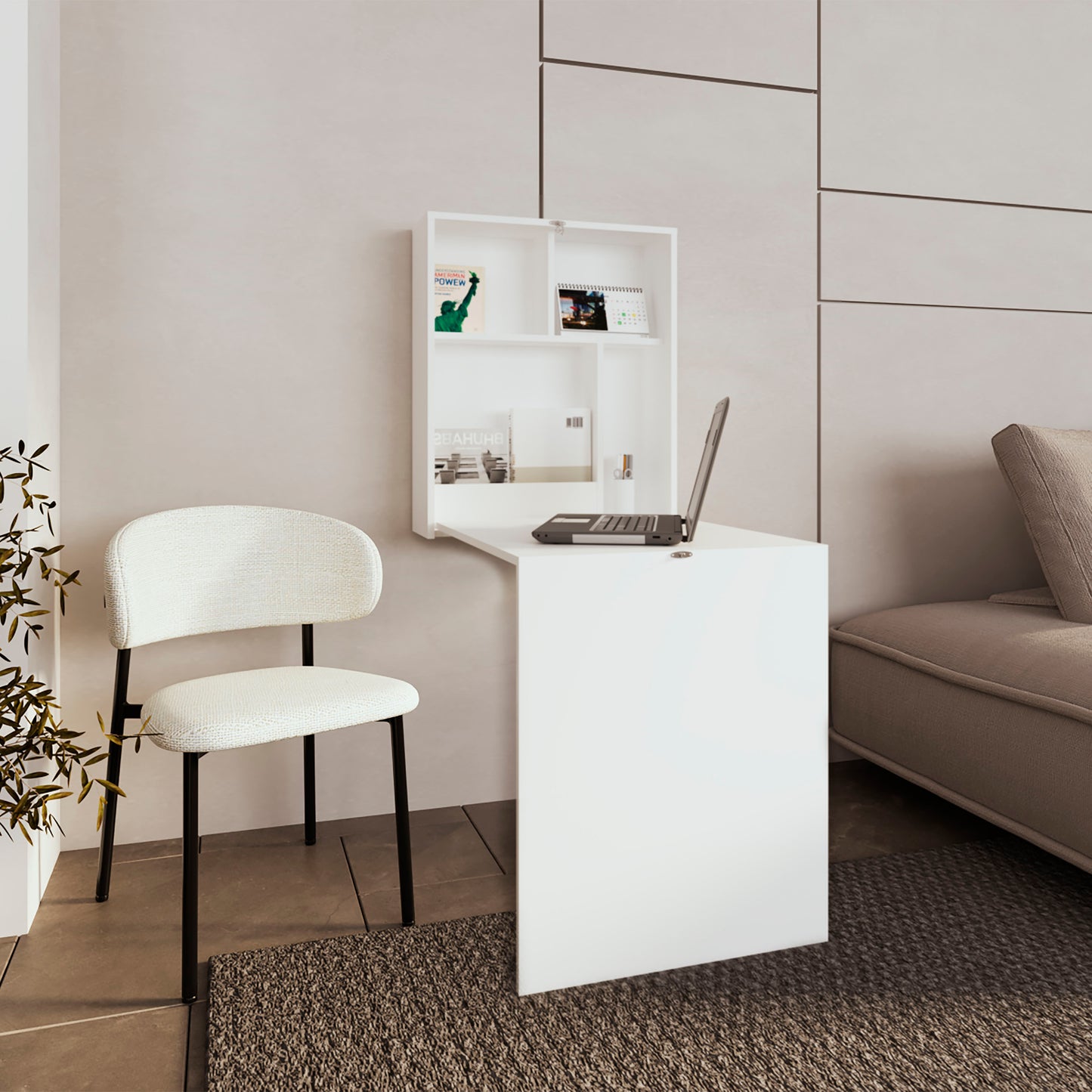 Compact white wallmounted desk with integrated shelving laptop open in a modern home office