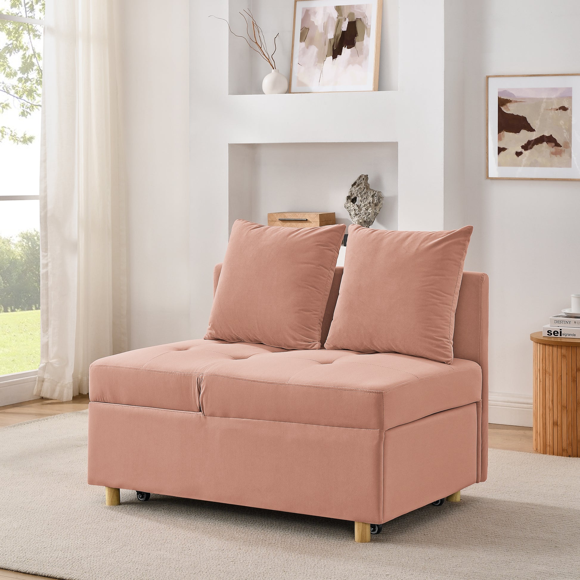 Dusty rose velvet sleeper chair with tufted seat and two accent pillows