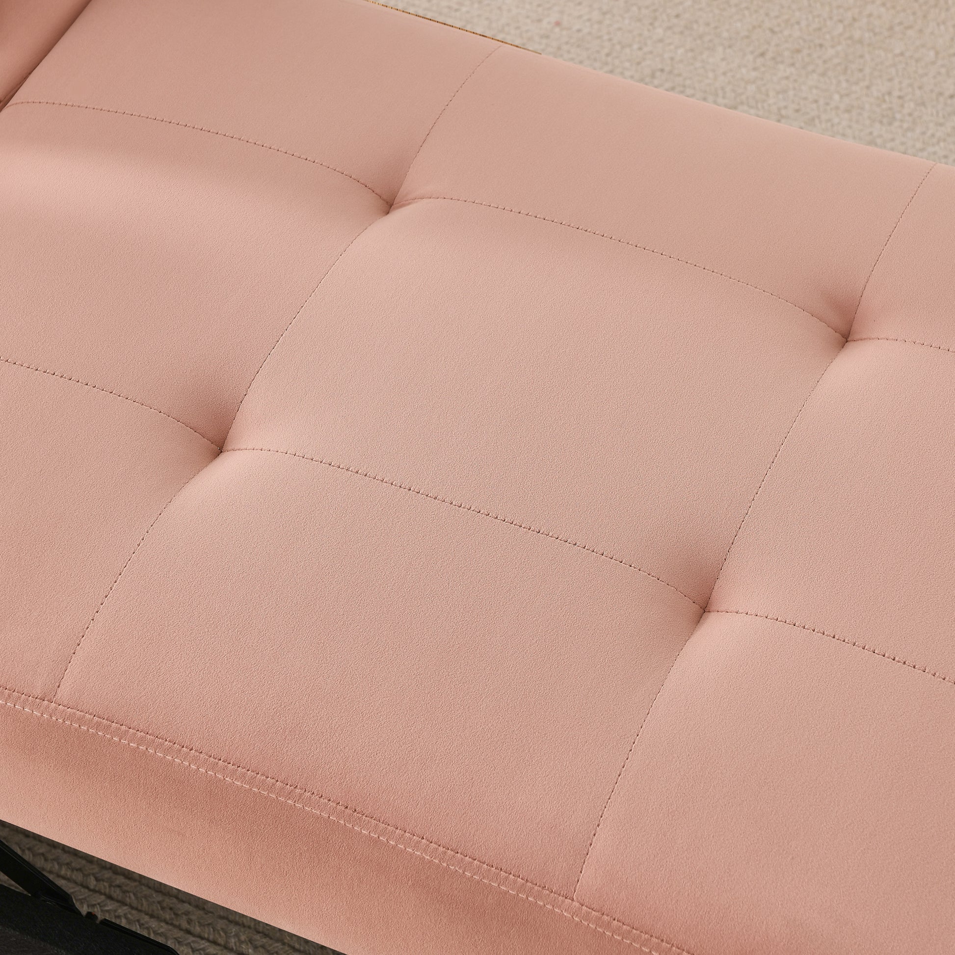 Tufted blush pink velvet bench with a modern design perfect for entryways or foot of bed