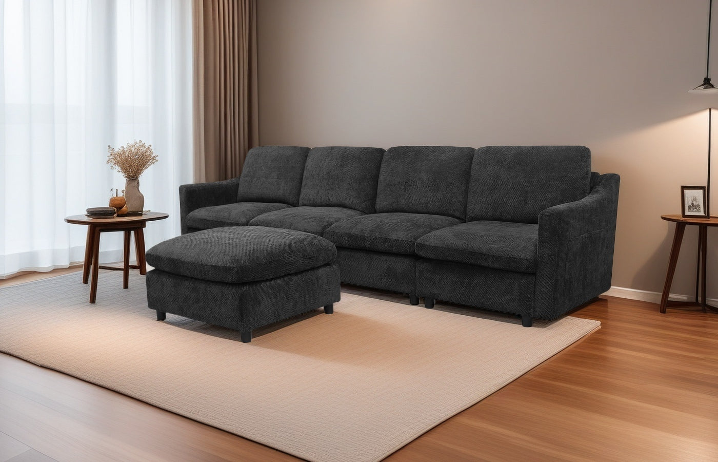 Dark charcoal modular sectional sofa with plush cushions and matching ottoman