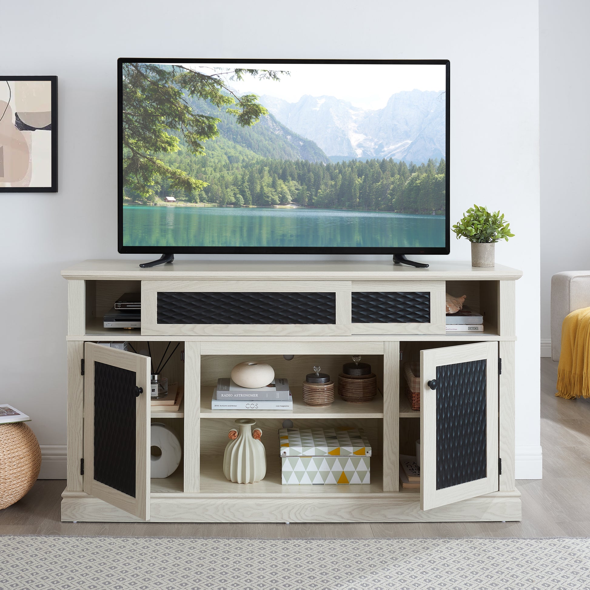 Light oak media console with black textured door inserts and open shelving