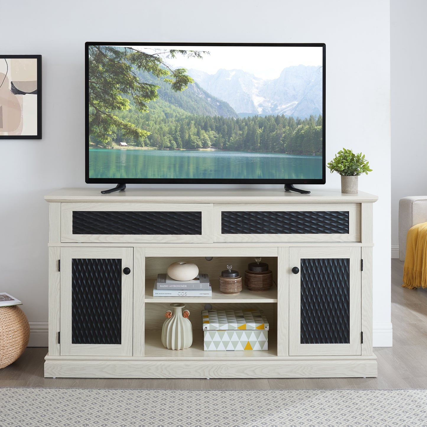 Light wood TV stand with diamondpatterned black doors and open shelves for media storage