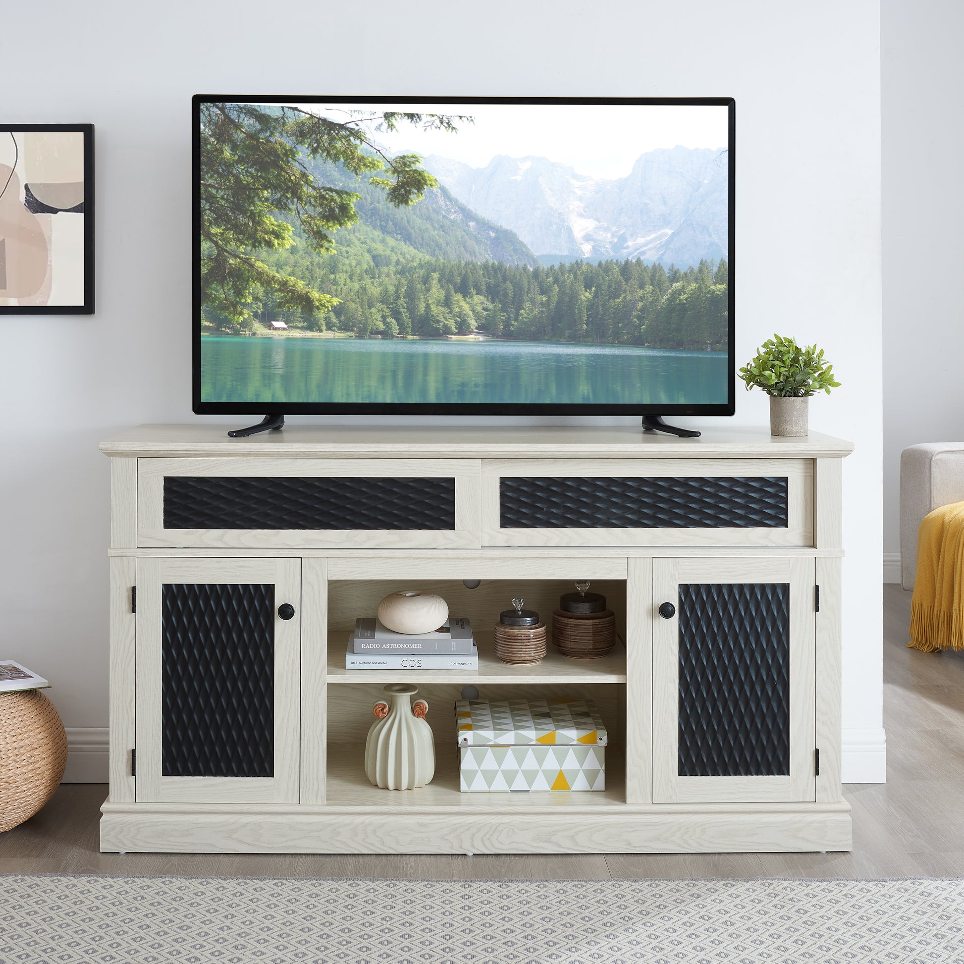 Light wood TV stand with diamondpatterned black doors and open shelves for media storage