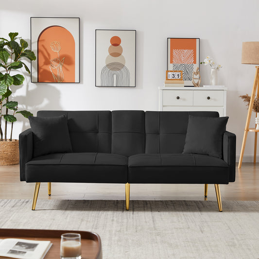 Black velvet futon sofa with gold tapered legs and tufted back cushions