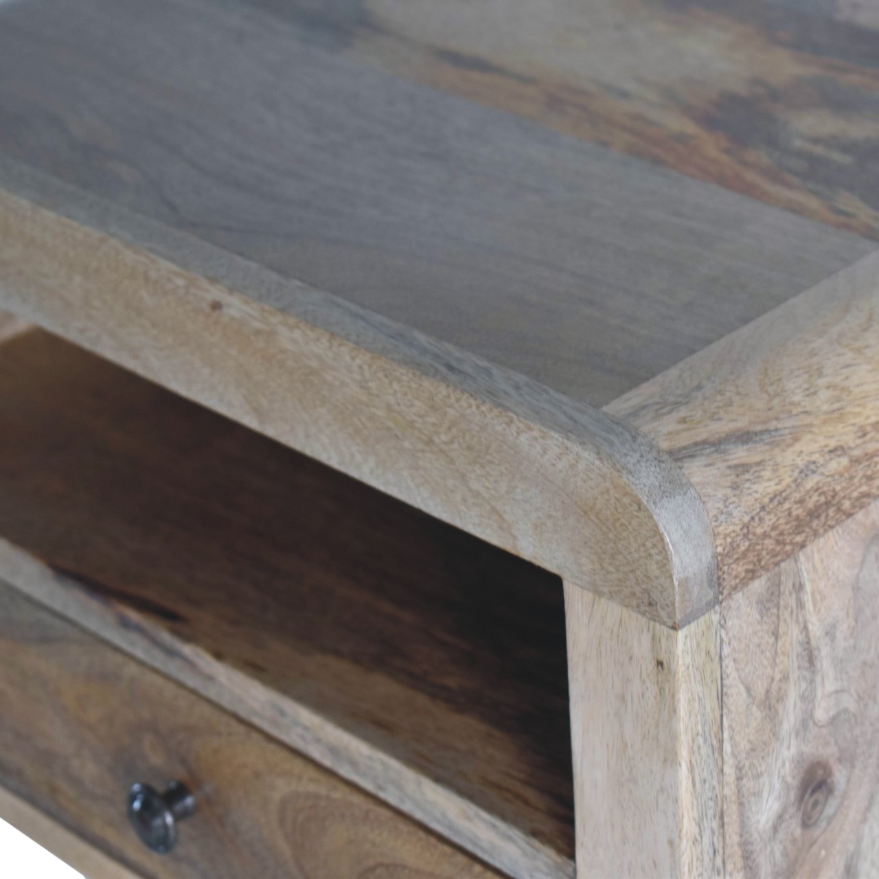 Closeup of rustic wooden side table with one drawer and open shelf