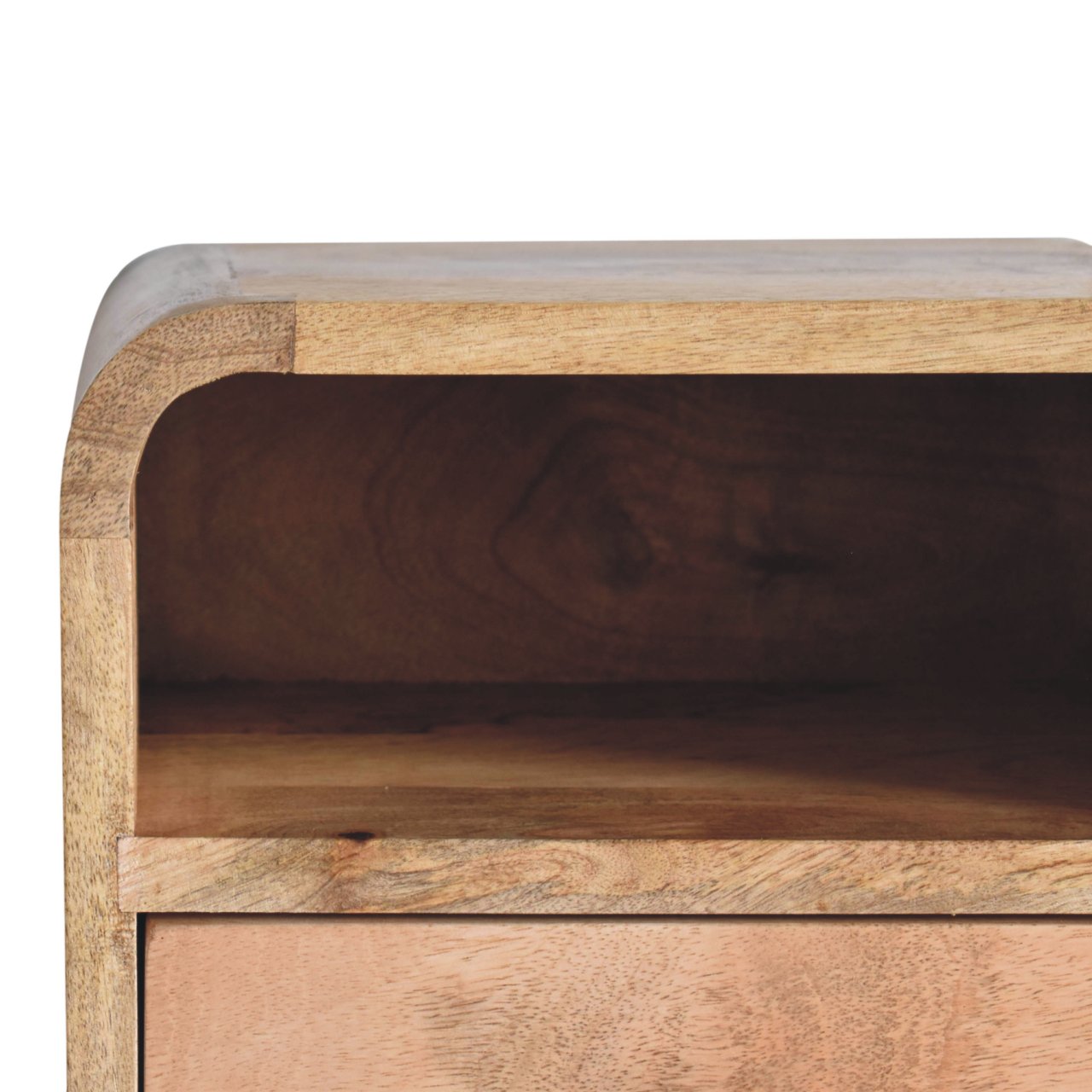 Closeup of natural mango wood nightstand with a rounded edge and open shelf