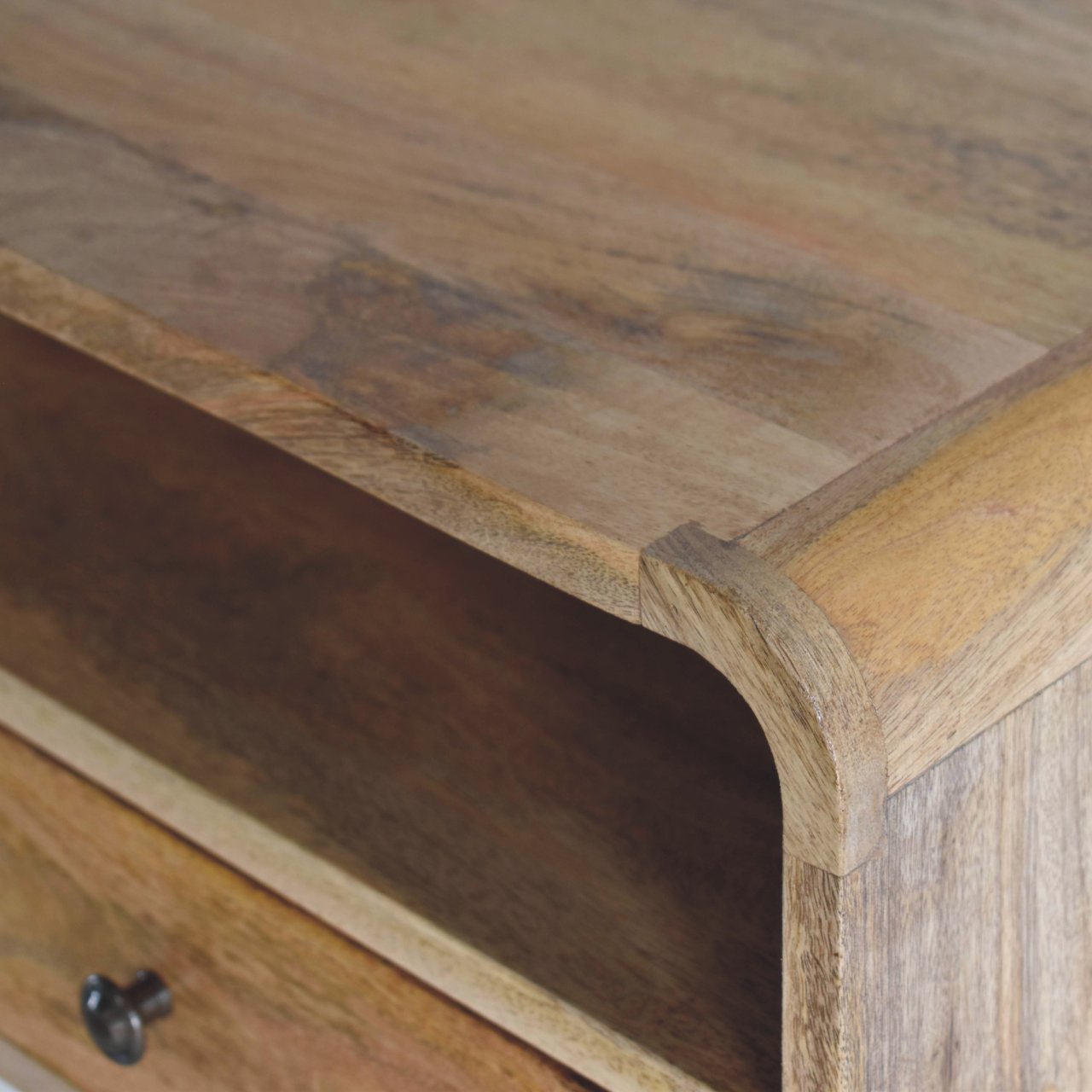 Closeup of natural wood texture on a solid mango wood console table