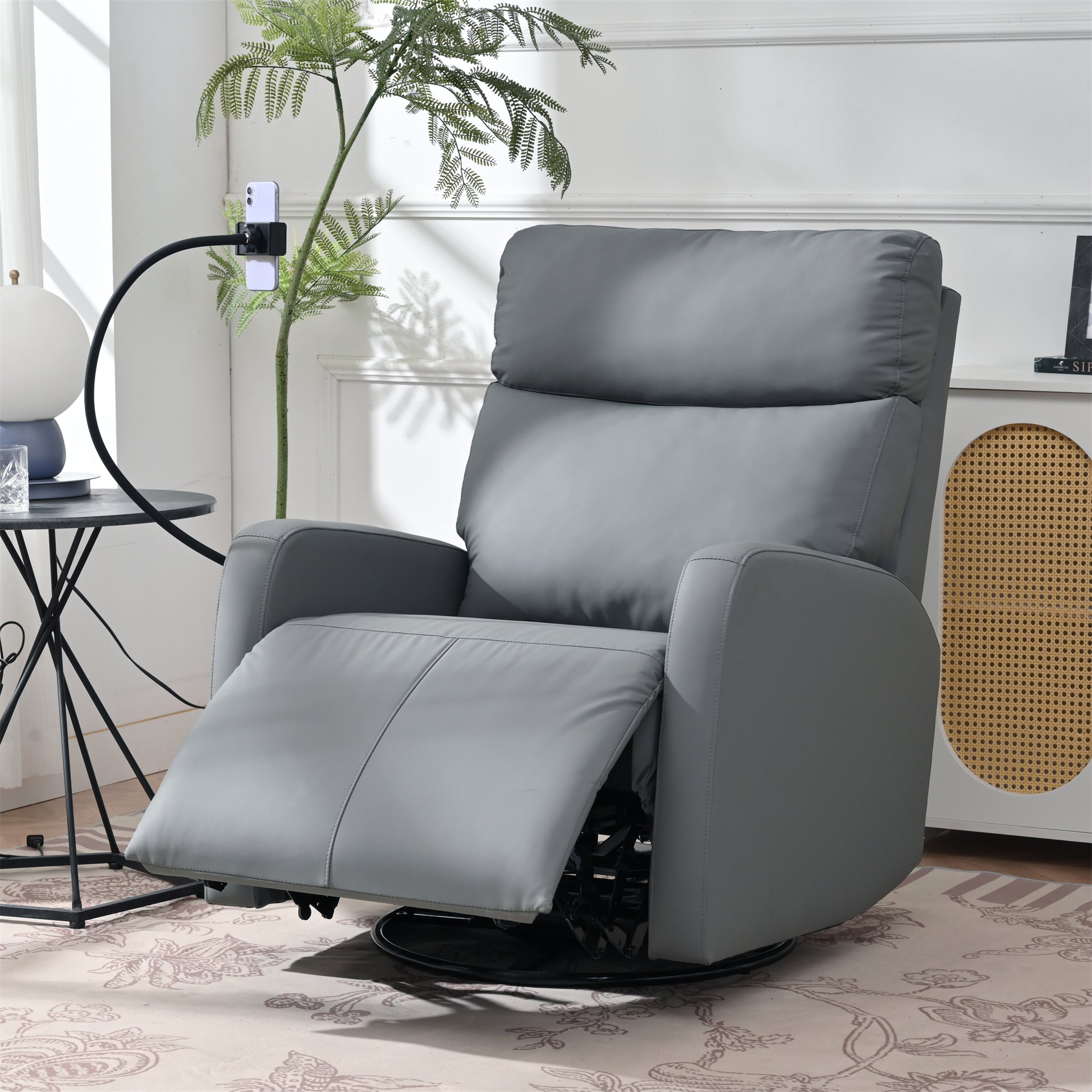 Gray faux leather recliner chair with adjustable footrest and swivel base