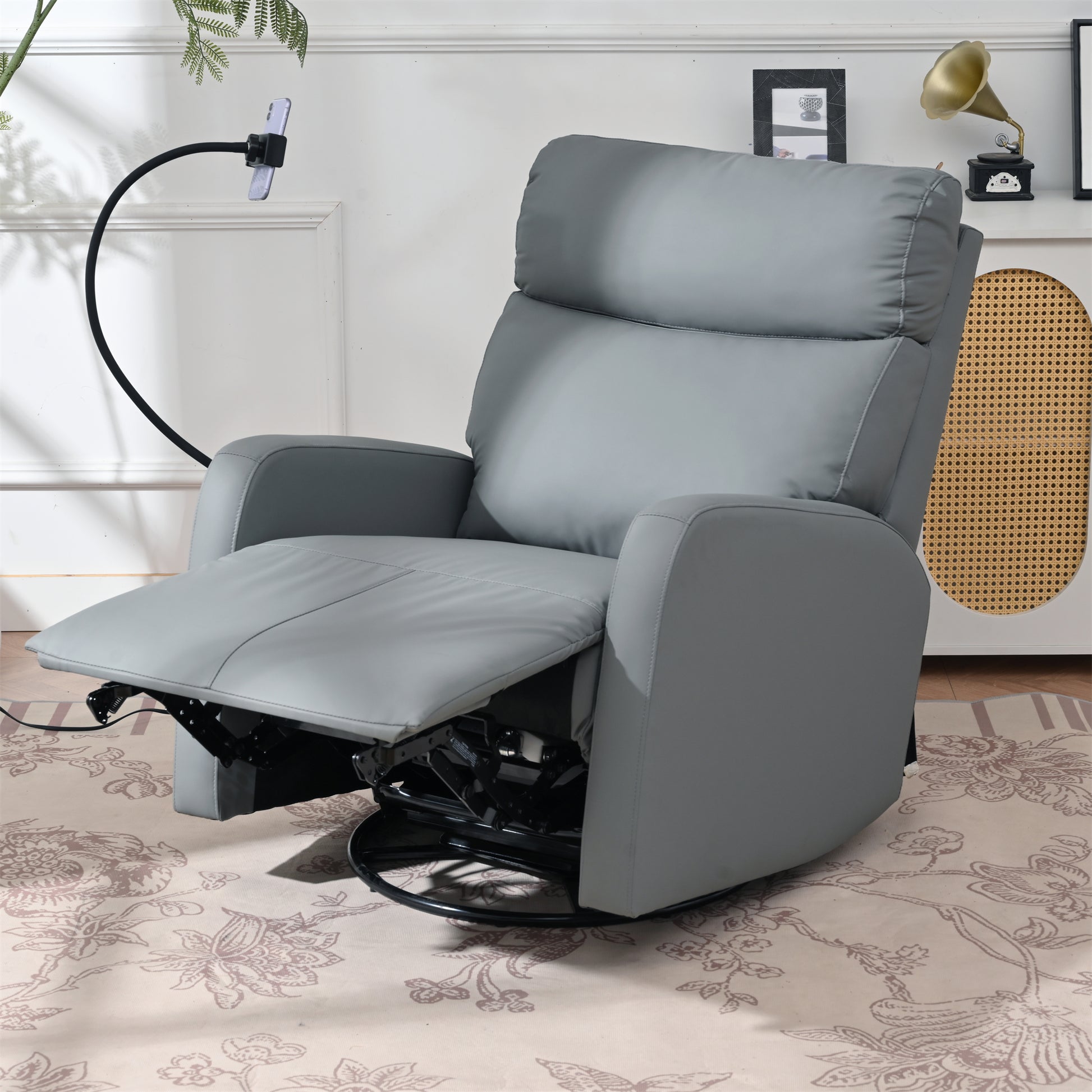 Gray leather recliner chair with swivel base and adjustable footrest
