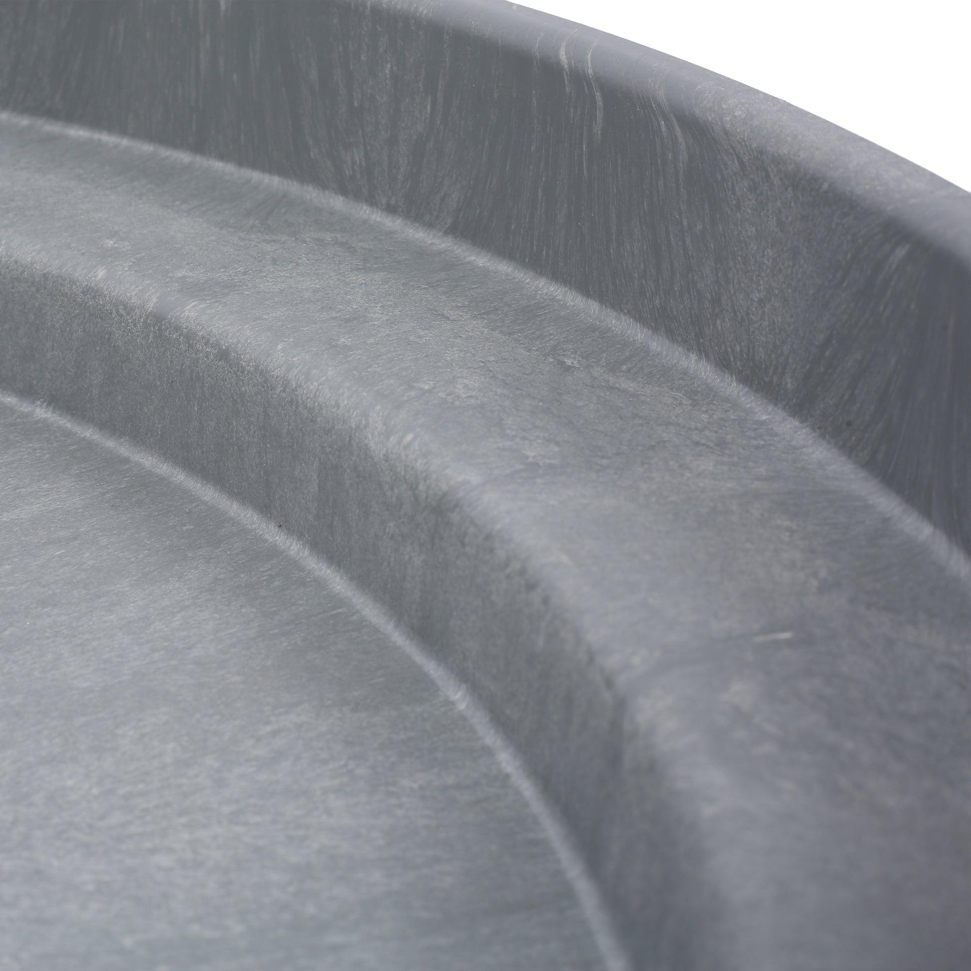 Closeup of the ribbed texture of a dark grey plastic storage bin Durable and versatile