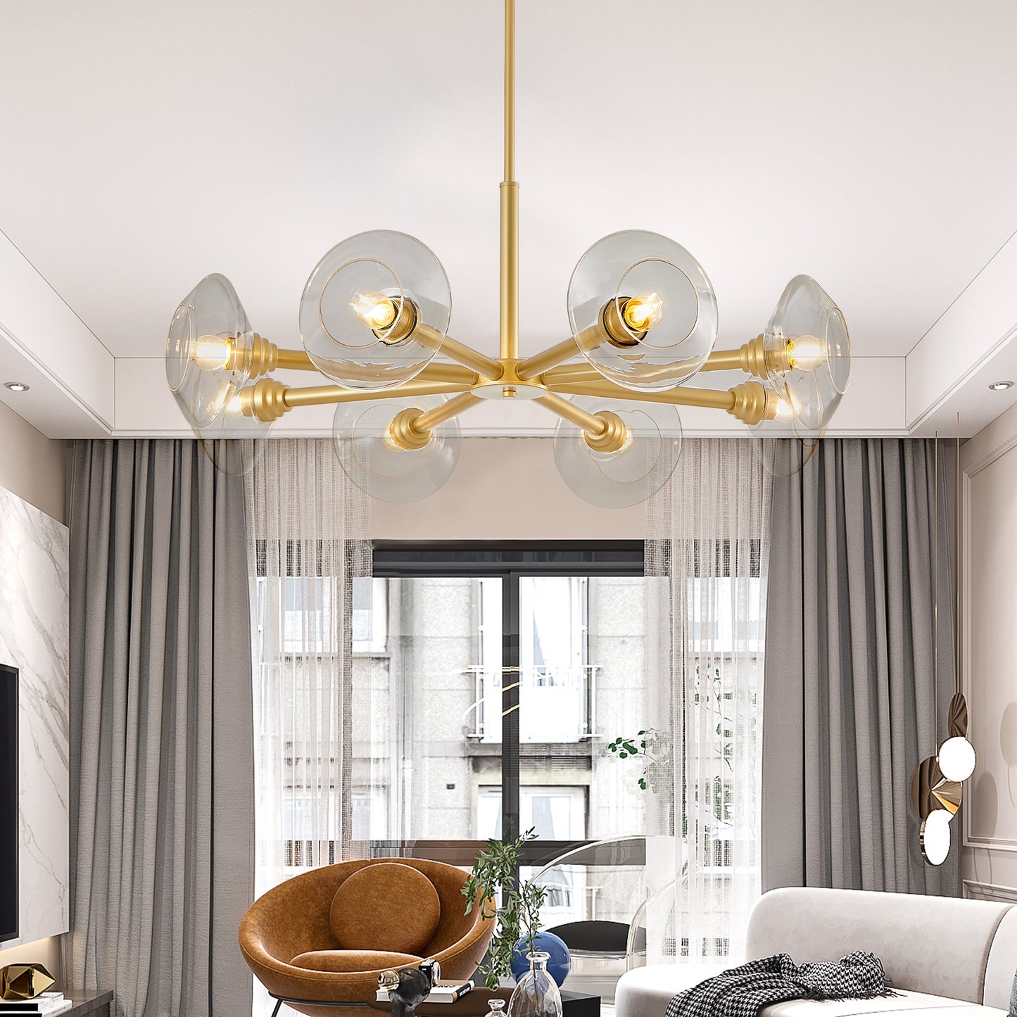 Modern gold chandelier with clear glass shades illuminating a stylish living room