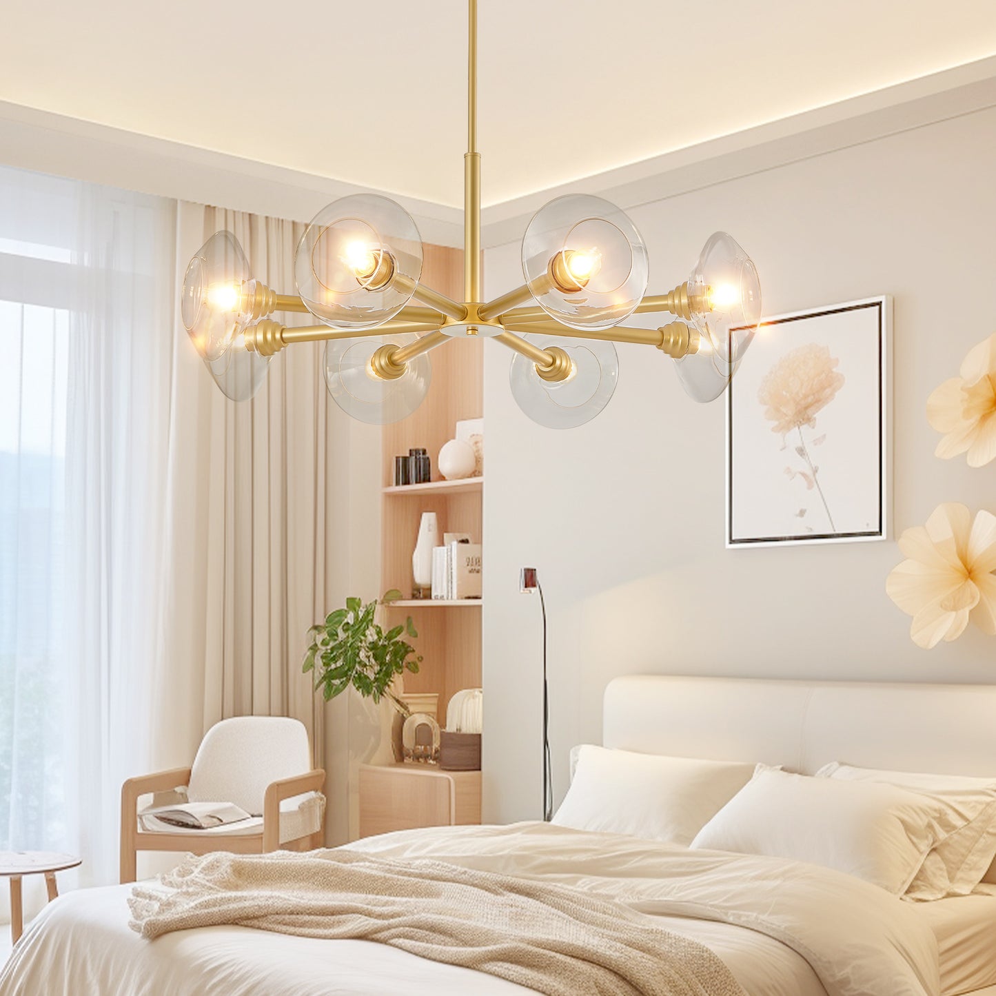 Modern brass chandelier with clear glass globe shades illuminating a stylish bedroom