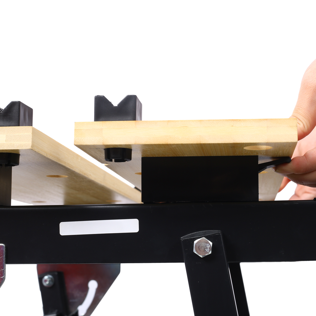 Bamboo workbench surface with black rubber holddowns for woodworking projects