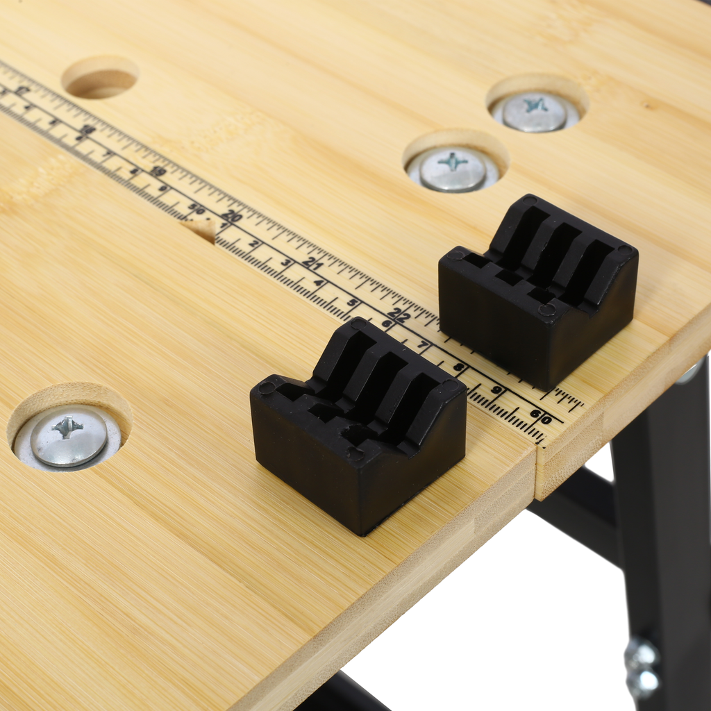 Compact workbench with integrated ruler and black rubber clamps for woodworking